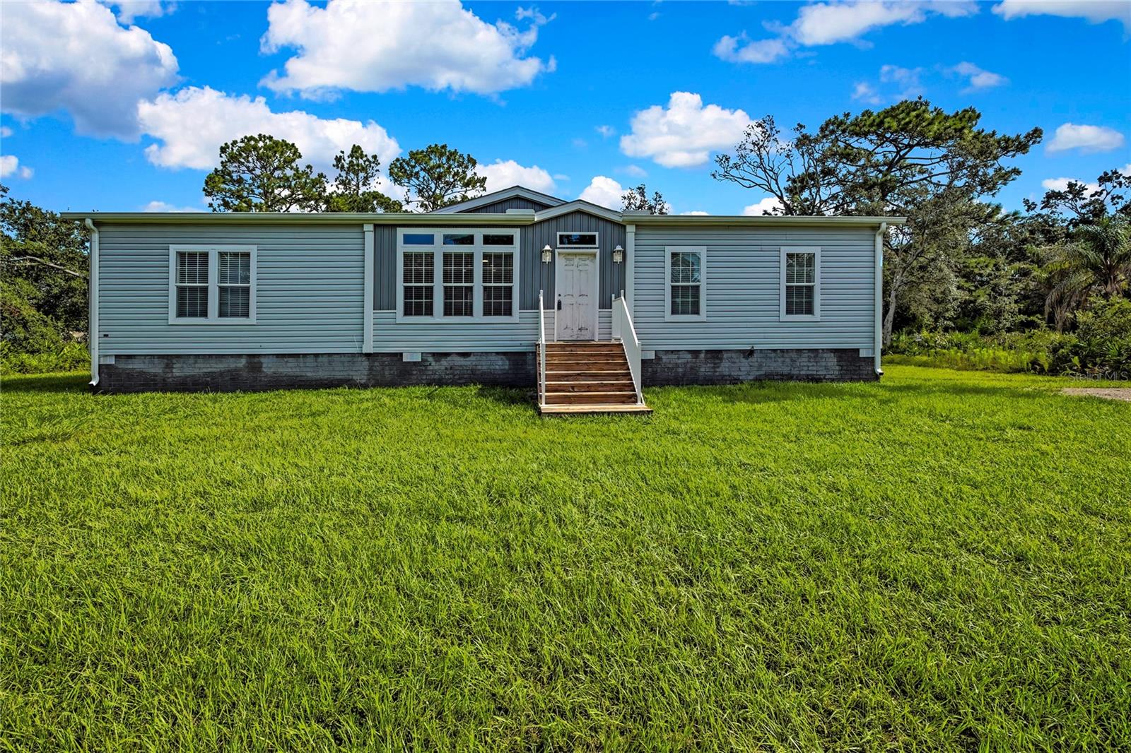 Welcome to this stunning like-new 2024-built home nestled on a quiet paved road in beautiful Homosassa, Florida! Offering modern comfort and thoughtful design, this spacious 3-bedroom, 2-bath residence boasts 1829 sq ft of living space and sits on a generous lot with a peaceful backyard setting.
Step inside and experience the open-concept layout, great for both everyday living and entertaining. The heart of the home features a large living area, a well-appointed kitchen with plenty of cabinet space, and a bright dining area filled with natural light. The split floor plan ensures privacy, with a luxurious primary suite that includes a walk-in closet and an en-suite bath with dual sinks and a walk-in shower.
Built in 2024, everything is near new—from the roof and HVAC to modern fixtures, finishes, and energy-efficient features. Outside, you'll find a spacious yard and a separate storage shed in the backyard, for tools, equipment, or extra storage.
Located just minutes from the Homosassa River, public boat ramps, shopping, dining, and the Gulf of America, this home offers both convenience and a quiet, nature-filled lifestyle.
Whether you're looking for a full-time residence, seasonal escape, or investment opportunity, this move-in-ready home is a must-see!
?? Schedule your tour today and experience all that this beautiful like new construction home has to offer.