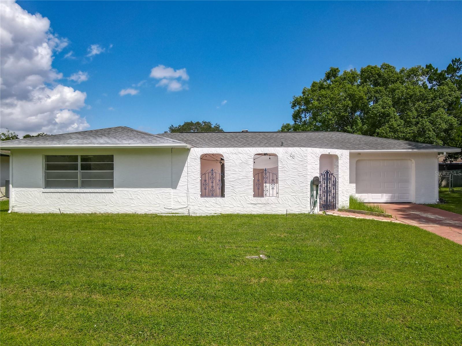 Welcome home to the sweetest home on the block! This amazing 2 bedroom 2 bath home is ready for you to call home. Walking in the front door you will be welcomed by new laminate flooring in the entry way leading to the bedrooms. The living room area features a beautiful decorative fireplace perfect as a centerpiece for the space & gathering for the holidays. The kitchen is nice and bright and opens up into an adjoining dining area which has a perfect view into the fenced in back yard. Enjoy the screened in back lanai for privacy, OR enjoy the cutest front courtyard with blue inspired wrought iron gate and accents. This home is truely unique on its own with the benefits of proximity to shopping, restaurants and beaches! Did I mention the roof is only 4 years young, The A/C & Hot water tank were replaced in 2022, new insulation in attic & skylight were replaced in 2023!
Make your appt today!