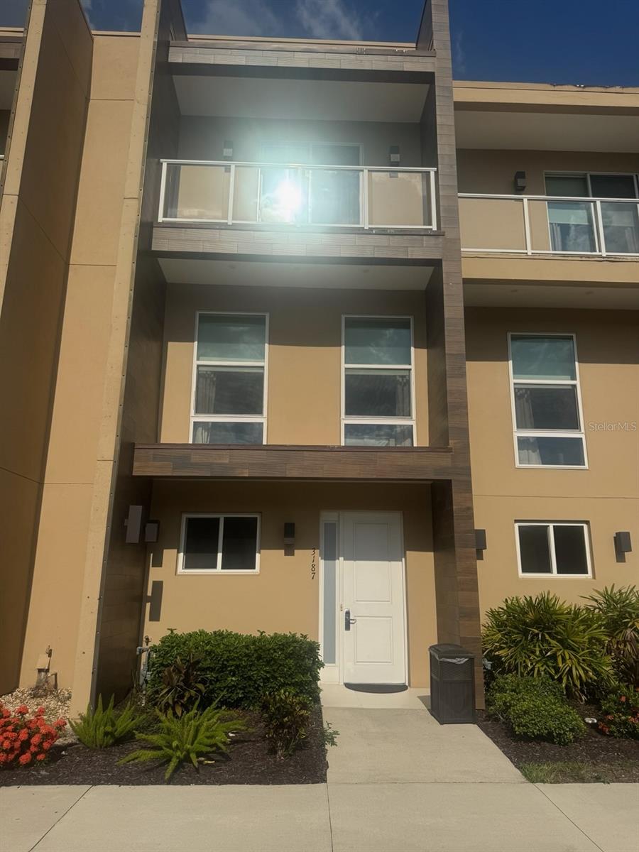 Welcome to Magic Village Yards — Where Luxury Meets Convenience in a Hotel-Inspired Vacation Home! Step into this beautifully modern townhome and indulge in the ultimate blend of upscale living and hotel-style amenities. Nestled just minutes from the Magic Kingdom and other world-class theme parks, this property offers a prime location for unforgettable vacations and lucrative investment returns. Exceptional Design & Turnkey Investment Professionally styled with high-end furnishings. Whether for personal enjoyment or short-term rentals, it’s ready to generate income from day one. Included are all the essentials and luxuries: Flat-screen TVs, Hotel-quality beds and linens, Premium kitchenware and appliances, Room to Relax & Entertain With 3 spacious bedrooms and 3.5 bathrooms—including two stunning master suites—this home comfortably accommodates families and groups. The open-concept living room dazzles with a soaring 2-story ceiling, expansive sliding glass doors, and a private balcony off the upstairs master retreat. Elevator included for ease and convenience. Outdoors Chef’s Paradise, enjoy a built-in outdoor kitchen complete with sink and grill—perfect for hosting gatherings or whipping up a delicious meal in the Florida sunshine. Top-Tier Community Amenities Magic Village Yards offers resort-level features that enhance every stay: 24-hour Concierge & Clubhouse, fully equipped Fitness Center, On-site house cleaning service and a delightful restaurant just steps from your door. Your Gateway to unparalleled comfort and top-rated amenities, this townhome is highly desirable for short-term renters—ensuring excellent occupancy and outstanding rental potential.