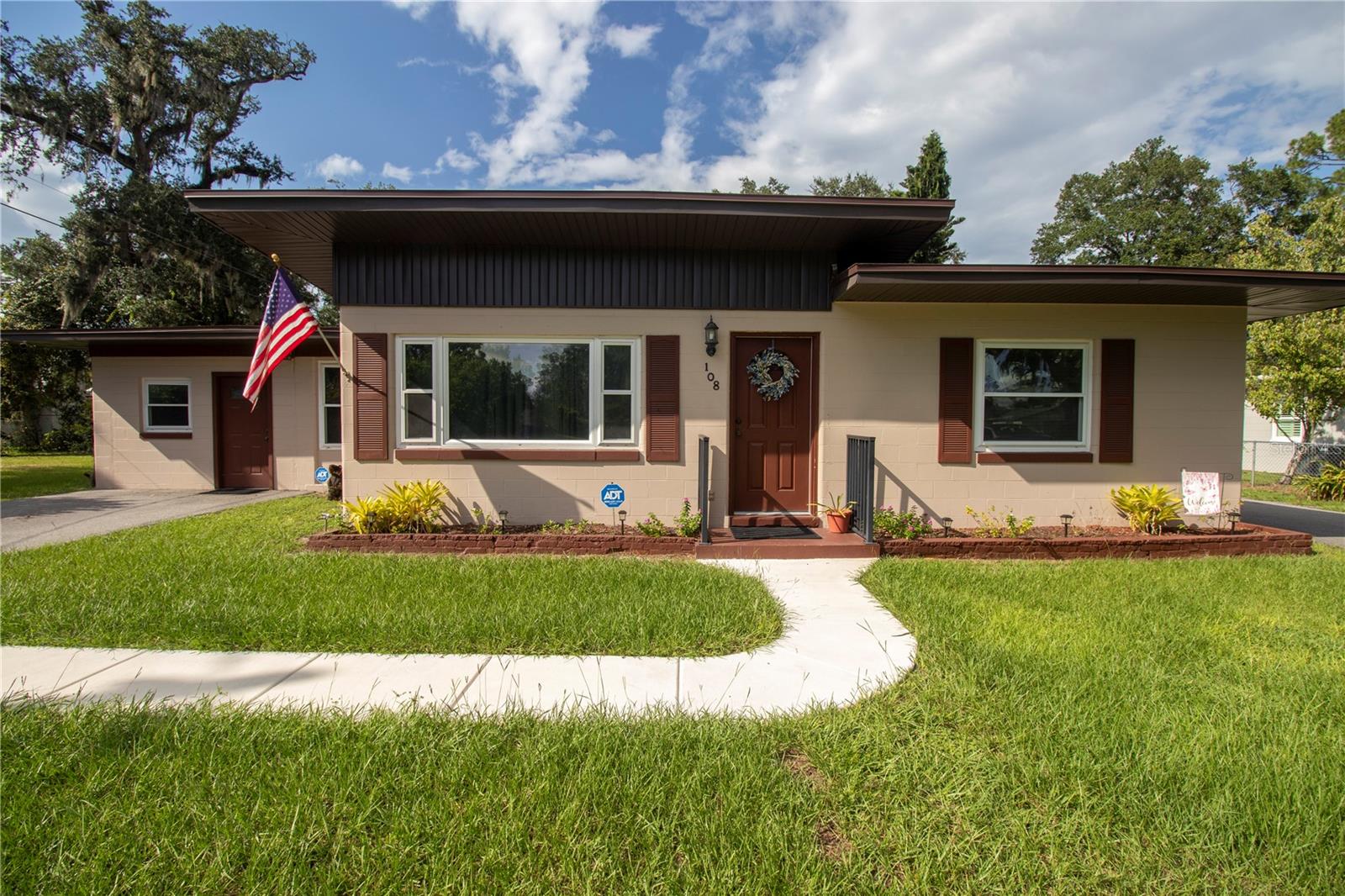 Beautifully Spacious Home in Desirable Loch Arbor – Workshop, In-Law Potential & Outdoor Living!
Located in the heart of Sanford, Central Florida, this well-maintained 5BR/3BA home sits in the charming Loch Arbor community, known for its scenic lakes and welcoming neighborhood feel. This spacious property offers flexibility, comfort, and value—perfect for multigenerational living or creative space needs.
The remodeled primary suite features a luxurious walk-in tile & pebble shower, luxury vinyl plank flooring, and fresh paint throughout. Enjoy the elegance of a renovated dining room, new baseboards, crown molding, and an inviting great room with cedar accent wall, Buck stove, and beautiful wood flooring.
The updated kitchen boasts tiled flooring, a newer Maytag fridge, a brand-new 2024 dishwasher, and a GE sensor dryer for modern convenience.
An enclosed carport leads to a spacious laundry area, storage space, and a versatile workshop with terrazzo flooring—perfect for conversion into a private in-law suite or guest apartment. Includes generator and Tesla hookups for added value.
Additional features include dual asphalt driveways, RV/golf cart carport, new sidewalk, 2018 roof, 2019 HVAC under service plan, and an ADT security system with outdoor cameras. Enjoy Florida living year-round in the screened patio with wood ceiling, ideal for relaxation or future outdoor kitchen.
Septic pumped (Sept. 2025). Home is being sold AS IS, but it's packed with thoughtful upgrades and endless potential. A rare find in a sought-after location—this is more than a house, it’s a place to call home.