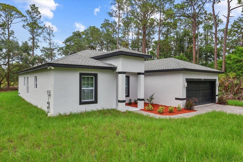 Photo of 2580 Plumosa Drive, Indian Lake Estates, FL 33855 (MLS # S5151754)