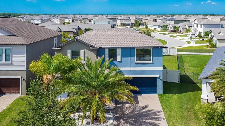 Welcome to your dream home with captivating curb appeal! This stunning 2 story home offers an array of features that make it an absolute gem. As you approach, you'll be welcomed by a beautifully landscaped front yard with pavers and a lush palm tree, perfect for rocking chairs on the paved front porch.

The interior of this home boasts an open-concept design, with an abundance of cabinets and ample storage space, making it a chef's paradise. The large kitchen island features dual Moen sinks and plenty of room for additional seating. There is a  designated coffee station that is the perfect touch for your morning routine. Crown molding graces the first floor, and the living room and dining room feature waterproof vinyl flooring, combining style and practicality. Hosting guests is a breeze with a convenient half bath on the first floor.

The main floor is where you'll find the master bedroom, complete with a spacious master bath. This bath offers dual sinks, a walk-in shower, a separate garden tub, and a linen closet. The walk-in master closet is custom-designed, reminiscent of California-style closets.
The second floor includes three additional bedrooms, one full bath with dual sinks, and a spacious loft that can be transformed into a TV room, playroom, or office. The backyard features a screened-in lanai so you can enjoy your summer nights bug-free and it also includes a fenced yard, ensuring privacy and convenience for your pets, and a full water softner system. This property offers low HOA fees, yet provides an array of amenities for your enjoyment. The community offers a lagoon-style pool, lap pool, tennis and basketball courts, a playground, and a dog park. To top it off, the community also has an elementary school, a grocery store, and a couple of restaurants. Home is also close to many grocery stores, restaurants, and magnet and charter schools. 

For those needing to commute, easy access to I75 and 41. Macdill AFB is only a 30-40 minute drive which makes this home a strategic choice. In your spare time, you're only a 10-minute drive from Apollo Beach Preserve and park, perfect for outdoor activities and enjoying nature.

Don't miss the opportunity to make this remarkable property your new sanctuary.