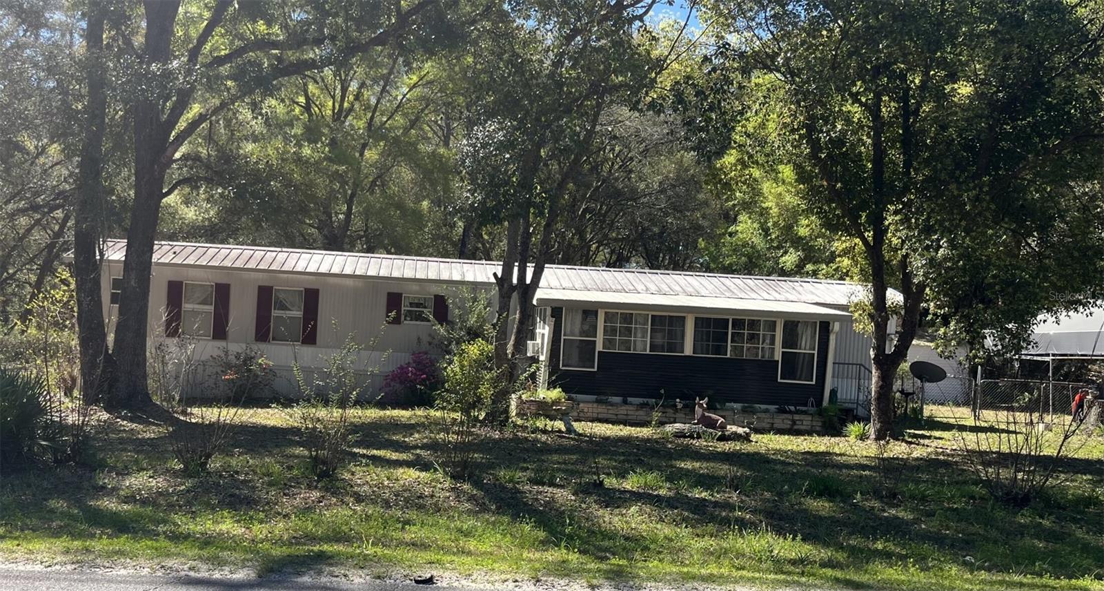 Endless possibilities on the just listed Mobile Home with two bedrooms and two baths situated on 1.25 acres with large out buildings and completely fenced in. This property would be Ideal for the business owner or pet owner. Call to view this property today.