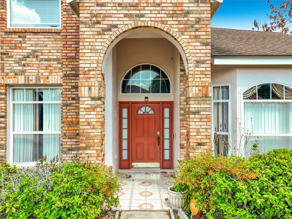 Photo of 7345 Woodworth Way, Orlando, FL 32818 (MLS # OM721837)