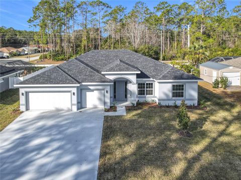 Photo of 16 Egan Drive, Palm Coast, FL 32164 (MLS # FC306987)