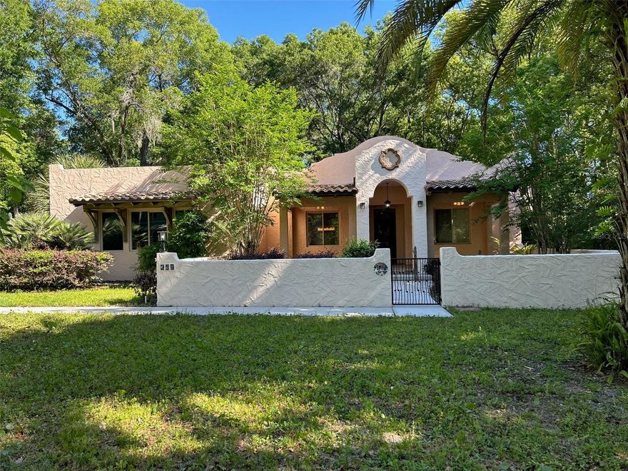 BEAUTIFUL AND UNIQUE CUSTOM HOME ON 1/3 ACRE LOT IN HEART OF LAKE HELEN. FANTASTIC LOCATION. NO HOA HERE.  THIS 3 BEDROOM 2 BATH GEM BOASTS A SPLIT PLAN WITH 2 PRIMARY SUITES AND A THIRD BONUS ROOM CAN ALSO BE A 3RD BEDROOM. DESIGNED FOR COMFORT AND FLEXIBILITY.  THE FIRST PRIMARY SUITE OFFERS A LARGE, SPACIOUS BATHROOM WITH SOAKING TUB, SEPARATE SHOWER, WATER CLOSET, AND TWO WALK IN CLOSETS. THE SECOND PRIMARY SUITE INCLUDES A PRIVATE BATH WITH A TUB SHOWER COMBO, IDEAL FOR GUESTS OR MULTIGNERATIONAL LIVING. 
VAULTED CEILINGS AND AN OPEN FLOOR PLAN AND SKYLIGHTS CREATE A BRIGHT, AIRY FEEL THROUGHOUT THE MAIN LIVING AREAS.
 THE KITCHEN SHOWCASES CUSTOM WOOD CABINETRY AND GRANITE COUNTERTOPS. CUSTOM FEATURES CAN BE FOUND THROUGHOUT THE HOME, ADDING CHARACTERR AND THOUGHTFUL DESIGN ELEMENTS AT EVERY TURN.

A SEPARATE BONUS ROOM WITH CUSTOM SLIDING DOORS PROVIDES FLEXIBILITY AND CAN EASILY FUNCTION AS A THIRD BEDROOM IF DESIRED. ADDITIONAL INTERIOR HIGHLIGHTS INCLUDE A SMALL OFFICE, INDOOR LAUNDRY ROOM AND ABUNDANT STORAGE.

ENJOY TRUE INDOOR-OUTDOOR LIVING WITH EXPANSIVE SCREENED WRAP AROUND BACK PORCHES. THE HOMES SLIDING DOORS FOLD INO THE WALL OPENING THE HOME TO ADDITIONAL LIVING SPACE DURING THE COOLER MONTHS. THE FRONT OF THE HOME FEATURES INVITING COVERED PORCHES OVERLOOKING A CHARMING COURTYARD, PERFECT FOR RELAXING OR ENTERTANING.
