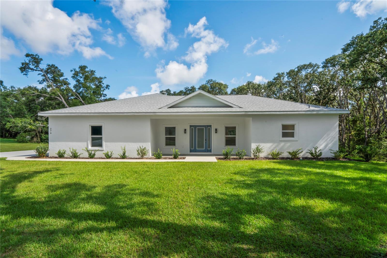 Welcome to this gorgeous 2024 new construction home in Citrus County, offering 3 bedrooms, 2 bathrooms, and 1,700 square feet of thoughtfully designed living space. Set on a sprawling 1.01-acre lot, 285 deep well, this property sits 80ft from the front property line and delivers a perfect blend of modern style and natural beauty. The kitchen will impress any home chef with its brand-new premium appliances, elegant quartz countertops, and abundant cabinetry for all your storage needs. Its open-concept layout flows effortlessly into the dining and living areas, creating a bright and inviting space for entertaining or relaxing. Sunlight pours through the expansive windows, enhancing the home’s warm and welcoming feel. The primary suite offers a tranquil escape with a luxurious ensuite bathroom and a spacious walk-in closet. Two additional bedrooms provide versatile space for family, guests, or an office. Outside, the large lot offers plenty of room for outdoor enjoyment, gardening, or even future expansions. Combining comfort, elegance, and room to grow, this home is a rare find. Schedule your private showing today!