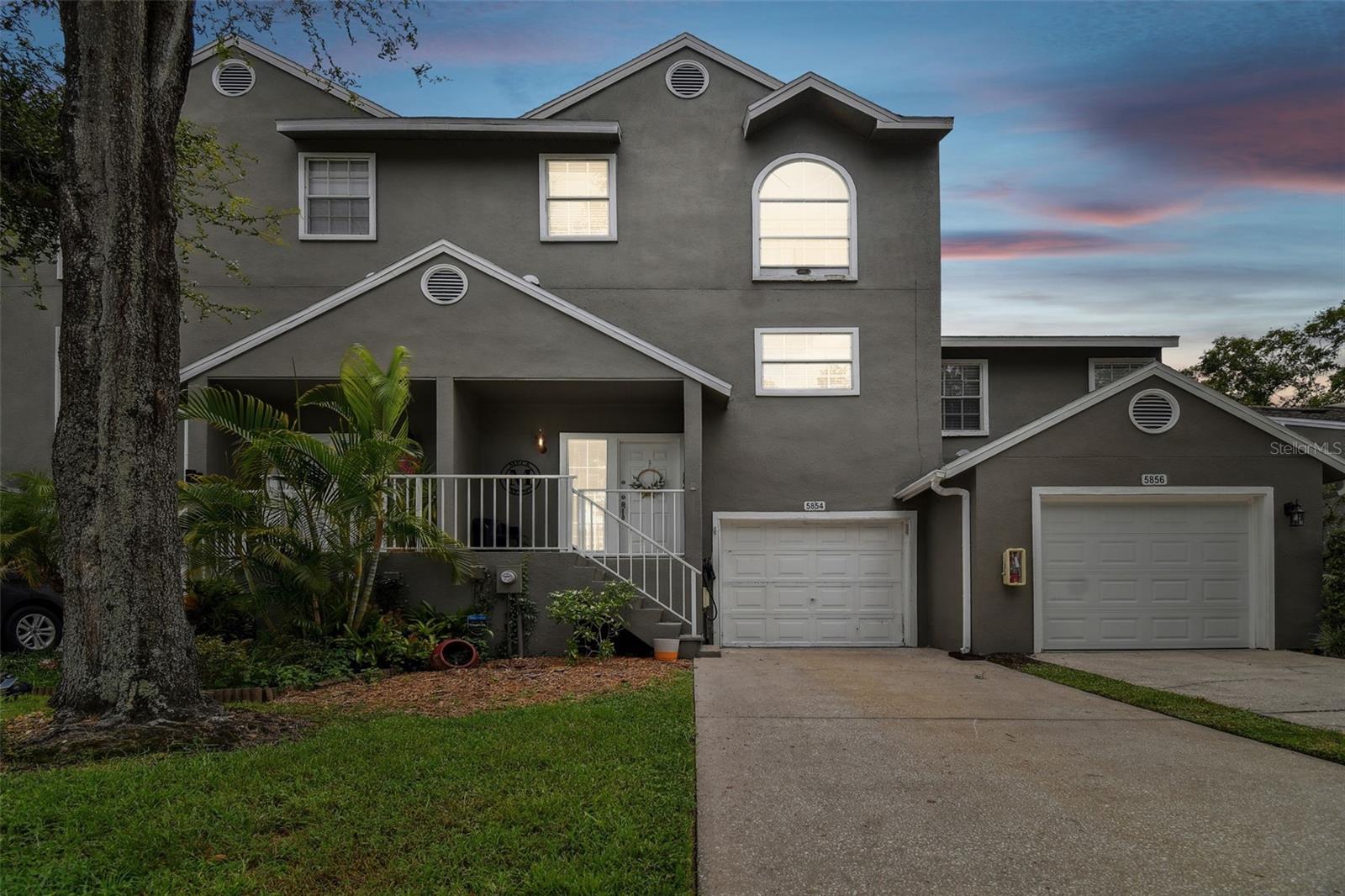 Don't miss out on this awesome and spacious, 3 bedroom, 2.5 bath, 1 car garage, townhome located in the heart of Carrollwood. As you enter the front door you can step down to the large laundry room, garage and bonus room with 18" tile with fire place that exits onto the private patio, with Jacuzzi, overlooking the conservation area. Going up the stairs at to first landing is a nicely finished half bath for guests. The next stop is the Dining room and family room finished with beautiful hardwood flooring and the second fire place. To the right is the kitchen that has been updated to include, raised panel cabinets with crown molding, black appliances, granite counters and tile flooring. All the bedrooms are upstairs. The large master suite has a double door entry, huge master closet and nicely finished bathroom along with a Brand New Balcony Deck, Brand New Water Heater, and Brand New Roof. The second bedroom is also very roomy with a nicely finished private bath. Small Freezer, portable a/c, and 2 door room refrigerator does not convey. Don't wait, call today for our private viewing!!!
