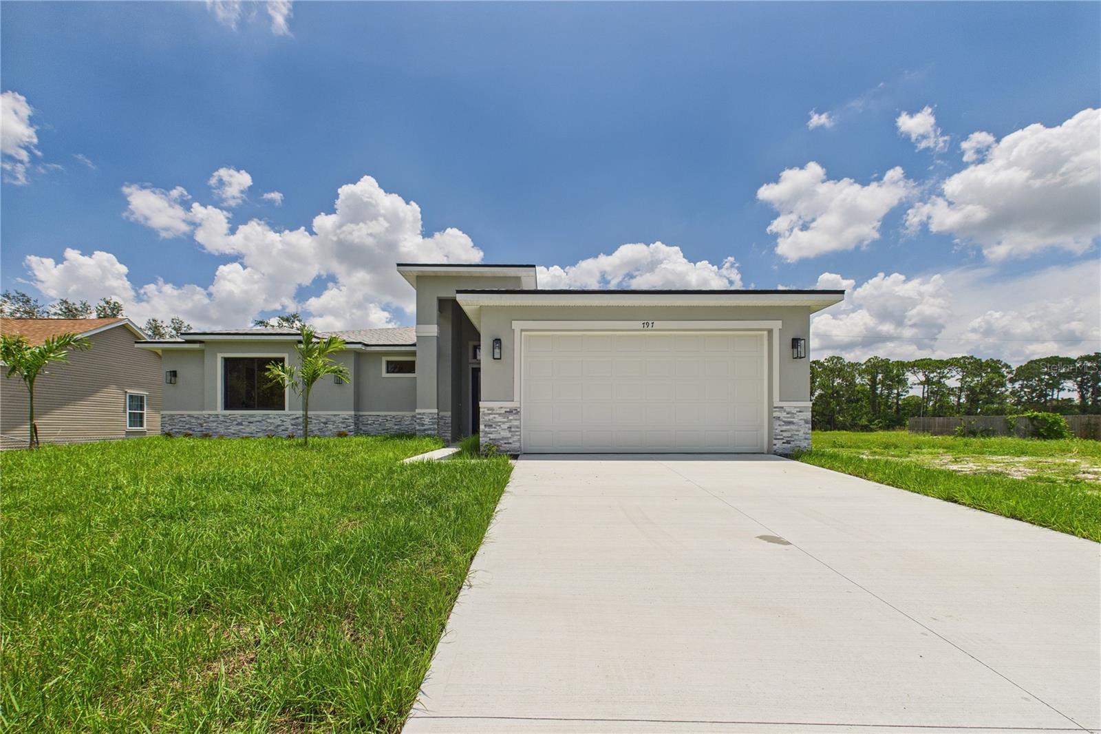 MULTIGENERATIONAL LIVING IS HERE! Have an aging parent or need extra space for family? This home is perfect for multigenerational living, featuring a separate entry and private bathroom, ensuring both privacy and comfort. Discover modern living in Palm Bay, close to shopping, dining, and more. This new build features 4 bedrooms, 3 full baths, office, and 2,108 sq ft under air. The sleek kitchen boasts a 9'x4' granite island with dual waterfall edges, Samsung appliances, and custom soft-close cabinets. 9.4' ceilings and all porcelain tile flooring throughout add a spacious feel. The primary suite includes double sinks, a tub, walk-in shower, and walk-in closet. Enjoy a covered rear patio. This home includes 1-year builder warranty, and 10 year structural warranty.