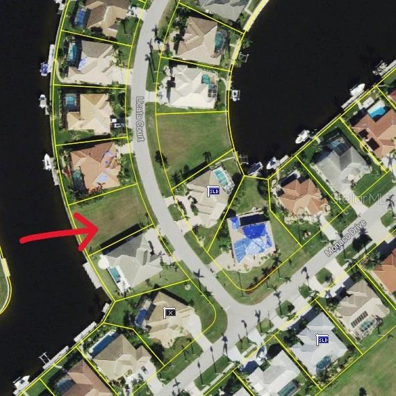 BURNT STORE ISLES WATERFRONT residential lot located in a desirable deed restricted community. Exceptional opportunity to have the best of everything with this lot...view of a canal & sailboat access. & is surrounded by upscale, beautiful custom-built homes. Build your dream home here. Catch a glimpse of the manatee that are often found in the canals. 71 ft of road frontage allows you to build your dream home. 90 ft of seawall maintained by the city of Punta Gorda provides access to your future dock. Enjoy boating from your backyard with ACCESS to Charlotte Harbor & golf right around the corner. Twin Isles Country Club is located in the center of the community. Practice your short & long game, brush up on your tennis strokes or simply enjoy the social setting. Burnt Store Marketplace anchors BSI offering a Publix, Home Depot & several other shops & restaurants. Get all our shopping done without leaving the neighborhood! Take advantage of the active lifestyle available here in Punta Gorda by enjoying the numerous walking & biking trails as well as the many waterfront parks. This lot is 10 minutes to historic downtown Punta Gorda shopping, dining, medical care, waterfront parks, boat ramps, fishing piers, walking and biking paths, art galleries, weekend farmers markets, events, Fishermen's Village and more. Easy access to US41, I-75 & Burnt Store Rd allows you to reach Ft Myers, Cape Coral & Sarasota effortlessly.