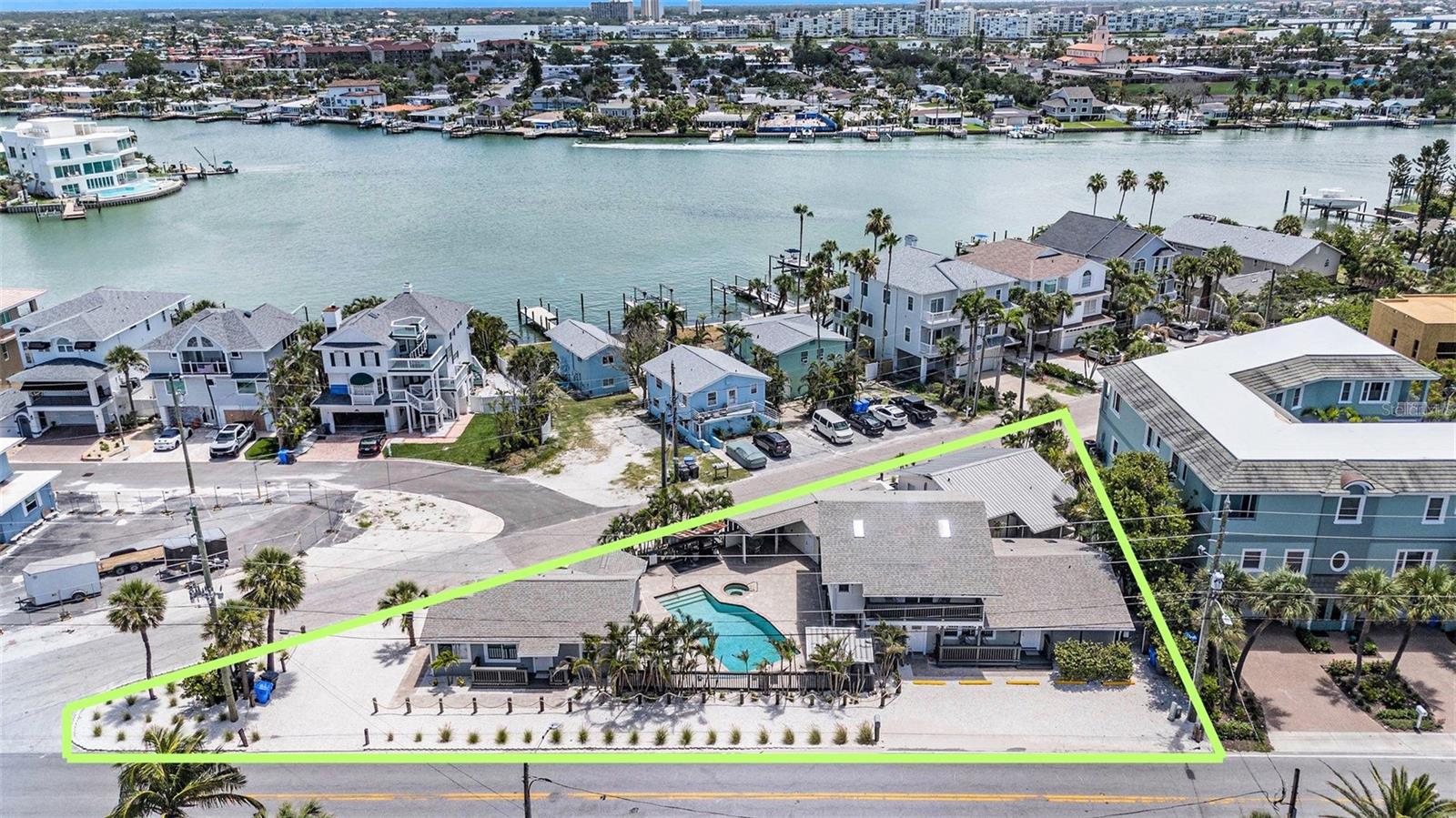 Welcome to The Point—an exceptionally rare, Long Island–themed beach compound just steps from the sand in Sunset Beach. Set on a unique triangular lot between the Beautiful GULF and the Intracoastal Waterway, this turnkey coastal retreat offers four private residences—three 2-bedroom, 1-bath units and one 1-bedroom, 1-bath cottage—each with open floor plans, full kitchens, private entrances, and stylish finishes including quartz countertops, shaker-style cabinetry, luxury waterproof vinyl flooring, brushed nickel fixtures, and impact-rated windows. The two-story unit boasts vaulted ceilings and a Gulf view. At the heart of the property is a private resort-style pool
surrounded by shell landscaping and lush tropical greenery. Just a few blocks away, enjoy live music, wave runner and boat rentals, and the only place in Pinellas County. where you can legally sip a drink with your toes in the sand—Caddy’s on the Beach. Host unforgettable events at Caddy’s or the historic Elks Lodge, both rentable venues just around the corner. RS-15 zoning provides The Point's owners incredible flexibility to use the property as a family compound, hybrid investment, or long-term beach retreat. Check with the City for details. Includes 12 off-street parking spaces, a garage with onsite laundry, and no HOA. All this—just a 15-minute drive to vibrant Downtown St. Pete.
Shown by private appointment only—this is Sunset Beach living like nowhere else.