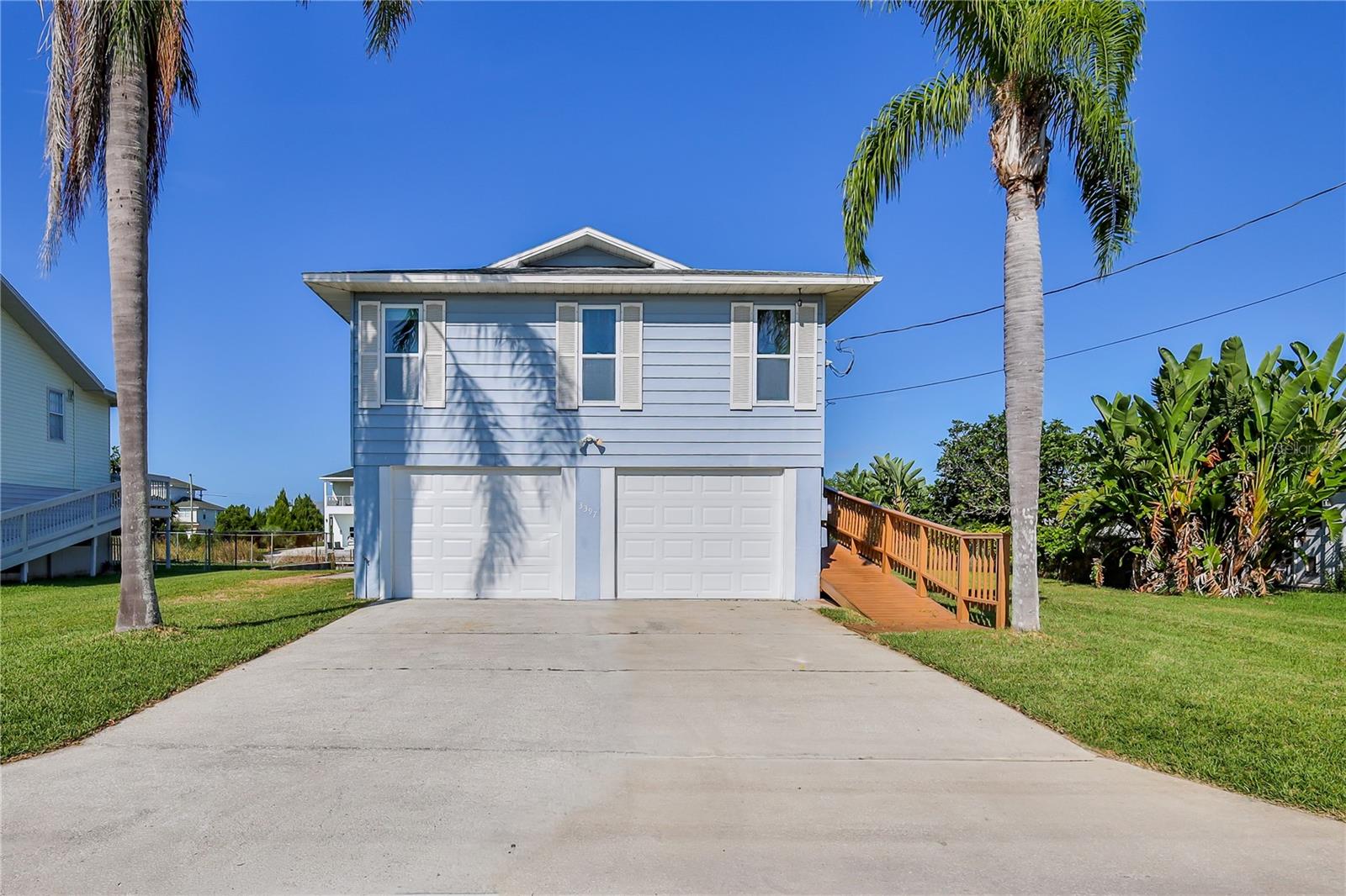Welcome to this 2 bedroom, 2 bathroom, 2 car garage, stilt-home located on a wide canal in Hernando Beach with indirect access to the Gulf. This waterfront property combines functionality and charm, offering comfortable living spaces indoors and desirable amenities outdoors.
Inside, you'll find laminate wood-look flooring throughout the living areas. The kitchen is designed with wood cabinets featuring convenient pullouts, granite countertops, stainless steel appliances, a breakfast bar, and a dining area. The kitchen opens to the great room, where abundant windows bring in natural light. Additional features of this space include two closets, stained-glass accents, and a converted sunroom that extends your living area and takes advantage of the water views.
The primary bedroom includes a walk-in closet and a private en suite bathroom. A second bedroom and full bathroom provide space for family or guests. Outdoor living is a highlight of this home. Two decks provide plenty of room for relaxation and entertaining, including a large 31' x 15' deck with running water. A widow's walk offers an elevated vantage point to enjoy expansive sunset views. On the ground level, you'll find a two-car garage, a large flexible space, and a convenient outdoor shower—ideal after a day on the water. Boating enthusiasts will appreciate the private concrete boat ramp, while a concrete parking pad provides extra space for a boat, trailer, or RV.
The roof was replaced in 2011. AC 2011. Golf Carts are allowed in this community. This property is located close to a public boat ramp, marina, and some of Hernando Beach's most popular waterfront restaurants. Whether you're searching for a primary residence, a seasonal retreat, or an investment opportunity, this home offers the coastal lifestyle you've been looking for. With water access, sunset views, and generous outdoor spaces, this waterfront gem delivers location, lifestyle, and value.