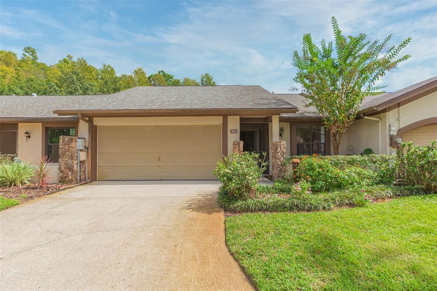 One or more photo(s) has been virtually staged. HARD TO FIND ONE STORY VILLA with a TWO CAR GARGE in the exclusive, gated community of The Clusters at Carrollwood Springs. INSANELY LOW HOA's @ $128 PER MO!! COMPLETELY RENOVATED and no detail was overlooked in this complete transformation nearly everything is brand new, and no one has lived in the home since the renovations were completed. This spacious 2-bedroom, 2-bathroom villa features an open floor plan with soaring ceilings and a large screened-in patio overlooking a private and serene waterfront lot perfect for enjoying peaceful views of nature, including frequent visits from otters and birds. Some of the recent upgrades (all completed within the past 6 months) include: New roof, New waterproof luxury vinyl plank flooring throughout, New baseboards, New interior and exterior paint, New lighting, fixtures, and ceiling texture, Completely renovated kitchen with soft-close white shaker cabinets, granite countertops, stainless hardware, and brand new white appliances, Fully updated bathrooms with new toilets, vanities, showers, and finishes, Updated electrical panel, HVAC replaced in 2022. Both bedrooms are generously sized primary suites with walk-in closets and private en-suite bathrooms. The Clusters at Carrollwood Springs is a small, private, one-road circular community surrounding a lake. Amenities include a recently renovated heated pool, clubhouse, new patio furniture, and regular community events. EXTREMELY LOW HOA AT JUST $128 PER MONTH! Not a 55+ community. Must own for 2 years prior to leasing. NO hurricane damage or flooding. Located in the heart of Carrollwood with easy access to shopping, dining, and major retailers including Publix, Target, Sprouts, Aldi, Whole Foods, Walmart, and more. This is a rare opportunity to own a like-new home in a highly sought-after community. Schedule your showing today—homes in this neighborhood do not last long!