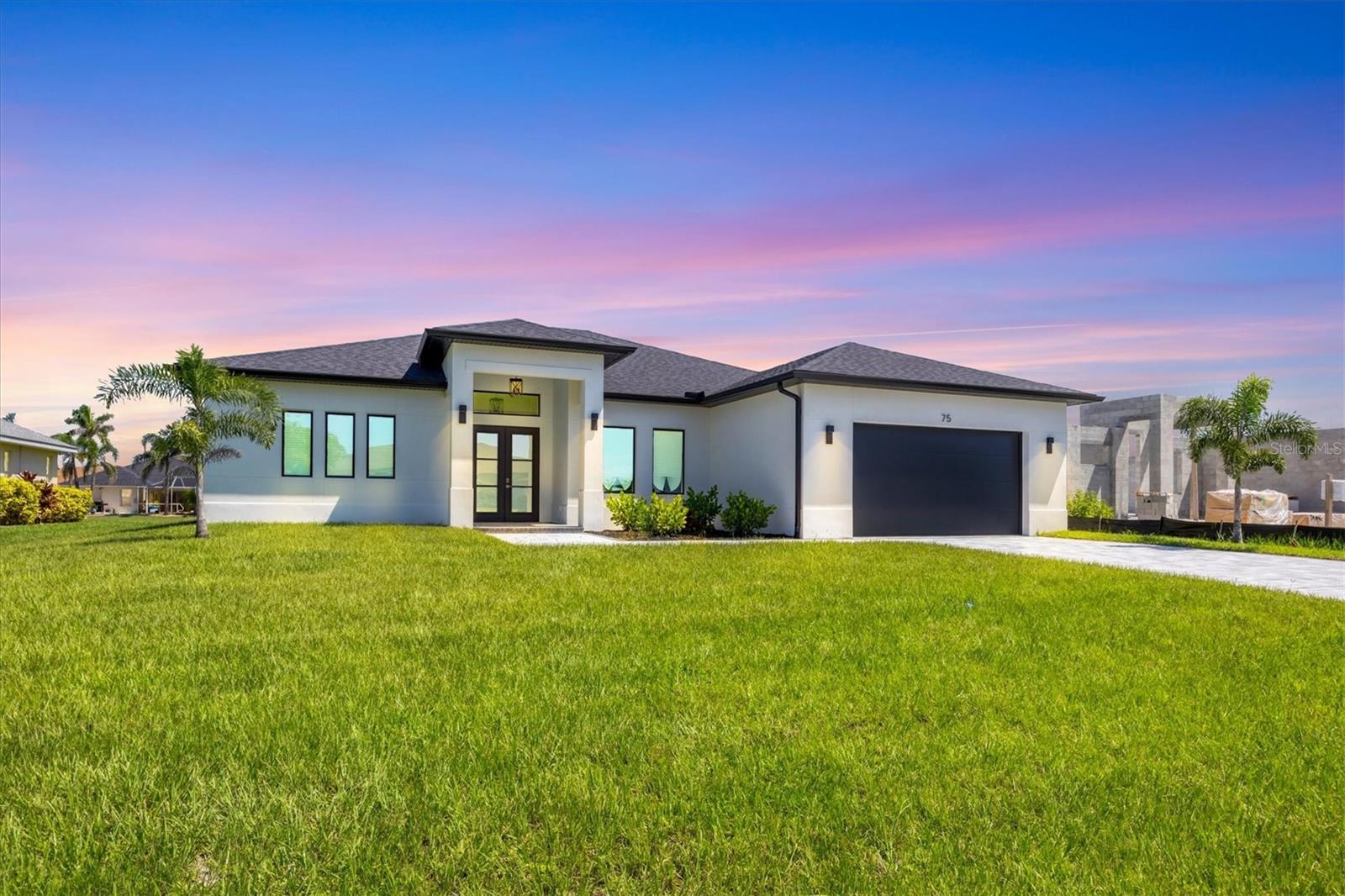 Immaculate Custom BRAND NEW BUILT WATERFRONT Home with Breathtaking Canal Views .Prime Location! POOL AND SPA! PUBLIC WATER AND PUBLIC SEWER! NO HOA OR CDD! ELEVATION FFE +11.47 FT. NOT FLOOD ZONE!
Step into luxury with this meticulously maintained, custom-built residence, perfectly positioned on one professionally landscaped lots with captivating views of a freshwater canal. Designed with an emphasis on open space, natural light, and elegant detail, this home offers the ultimate Florida lifestyle.
Open-Concept Layout with soaring volume 10 FT ceilings and both single and double coffered accents
CUSTOM KITCHEN
QUARTZITE COUNTERTOPS
HIGH END APPLIANCES(kitchen aid)
PLUMBED FOR OUTDOOR KITCHEN AND SHOWER
PANORAMIC VIEW POOL SCREEN CAGE
HEATED POOL/SPA
OUTSIDE BATHROOM
Zero-Corner 8-Foot Sliding Glass Doors that seamlessly integrate indoor and outdoor living spaces
42” Soft-Close Wood Cabinetry,QUARTZITE countertops, breakfast bar, and UPGRADED KITCHEN AID stainless steel appliances in the upscale chef’s kitchen
Casual Dining Nook with tranquil canal views.
Diagonal Ceramic Tile Flooring throughout main living areas for a seamless feel
Luxurious Master Suite featuring:Two spacious walk-in closets plus an additional storage closet.
Direct access to the lanai via sliding glass doors.
Spa-like en-suite bathroom with walk-around tile shower, dual QUARTZITE vanities, and private closet
Guest Accommodations
Two generously sized guest bedrooms with ceiling fans and large closets
Second full bathroom with walk-in shower, perfectly situated to serve both guests and the pool area
Outdoor Oasis
Expansive 57' x 20' screened paver pool deck with a sparkling pool and tranquil fountain feature
Oversized covered lanai, ideal for year-round entertaining
Lush landscaping with concrete edging and canal-fed irrigation system (canal water saving on your water bill)
Additional Highlights
2-Car Garage with durable epoxy-coated flooring
Brick paver driveway and walkways enhance the home’s stunning curb appeal
Impact-resistant windows and doors for security and peace of mind
Substantial windstorm insurance credits thanks to impact protection
Centrally located near top-rated golf courses, fine dining, boutique shopping, and world-class marinas with direct access to the Intracoastal Waterway and the Gulf of Mexico. Just a short drive to pristine beaches, nature preserves, and some of the best fishing in the state.Experience the best of Florida with nearby beaches, golf courses, and outdoor recreational activities just a short drive away. Don't miss out on the chance to own this extraordinary home.