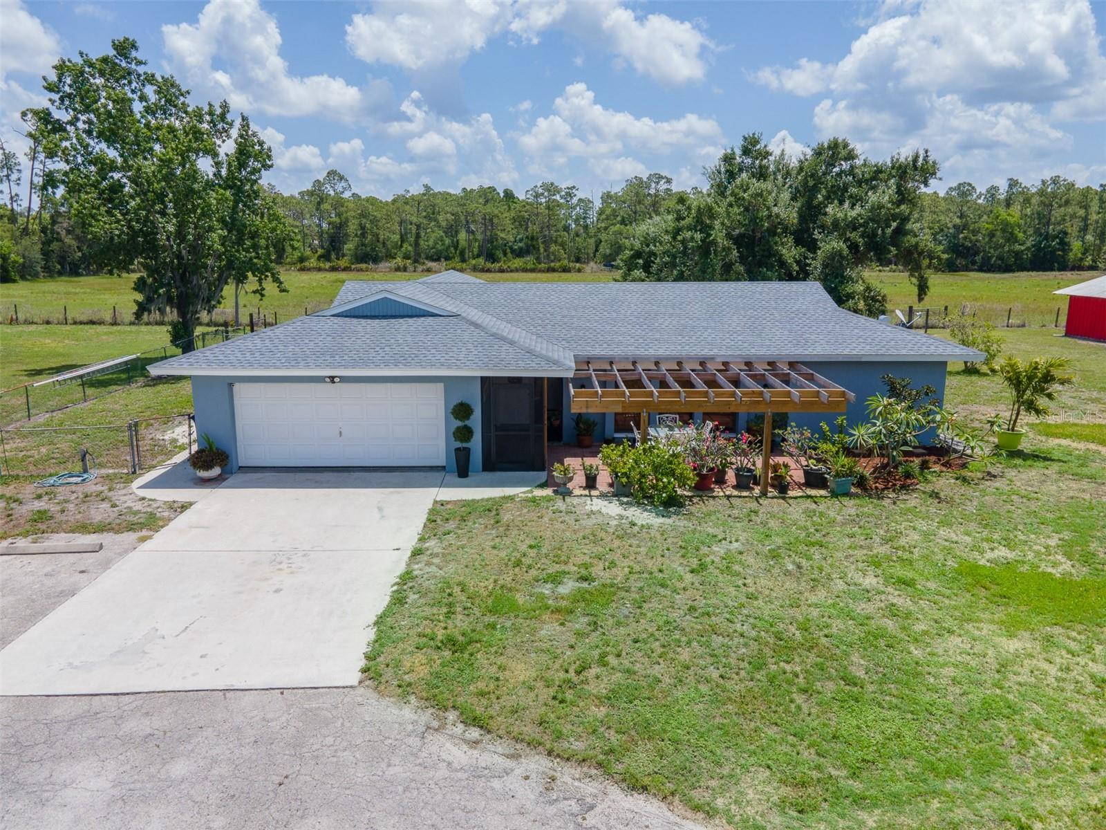 The perfect size equestrian estate is now available! Already carrying Agriculture exemption on taxes. It is NOT IN A FLOOD ZONE! This 3 bedroom, 2 bathroom home with its open floor plan, modern amenities, and extensive equestrian facilities, is ideal for horse lovers and those who appreciate outdoor living. The photos were taken in May during the dry part of the year. The property is now covered with lush grass which is the case most of the time. The Concrete Block house has a new roof from July of 2024, with two newer AC units (fall of 2022 and spring of 2023). New well pump 2022, most of the softener equipment is newer also. Screened back lanai is wired for a hot tub and spacious enough to grill and dine whenever you wish. There is a dog pool in place which can be removed, leaving plenty of room to add an inground pool with screen enclosure. The elegance of mature Oaks help shade the property and all 3 pastures have Lean-tos. The 74 ft by 36 ft barn features 7, 12 ft by 12ft stalls with an additional feed stall which could be converted into another stall. All with rubber mats, auto waterers and fans for comfort. The Air conditioned 12 ft by 12 ft tack room provides a dedicated space for gear storage. A large bird cage located in the main barn could be used for chickens, rabbits or other pets. There is a washer in barn for convenience. The wash rack is equipped with an overhead boom hose that adds to the functionality of this exceptional property.
There is also a 24 ft by 24ft barn that has run out stalls to one of the pastures. At least 11 water spigots located around the property for ease of watering. The round pen stays and there is a 70 ft by 100 ft riding arena. Ram fencing has been used for most of the pastures. This can be an income producing property for horse boarding, training, or lessons.
Secure and Private: Fully fenced and gated, this estate is set back from busy roads, offering peace and tranquility.
Located just over a half mile from the Van Roekel Associates veterinary clinic. Also, just a short drive to at least 3 grocery stores, several restaurants, Lee Health, a Fitness center, walking parks, a new Marshalls, Ace hardware, Pet Supermarket, and more stores coming soo. A marina is located just over 3 miles away and there are several boat launch sites within a short drive. Property is just over 4 miles from Exit 143 on I75, with easy access to schools and businesses.
This equestrian estate is not just a home; it's a lifestyle. Don't miss out on the opportunity to own this incredible property!