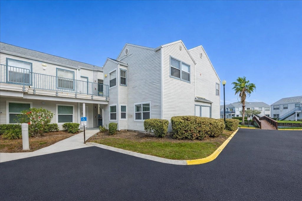 Photo of 2540 Woodgate Boulevard #106, Orlando, FL 32822 (MLS # O6442806)