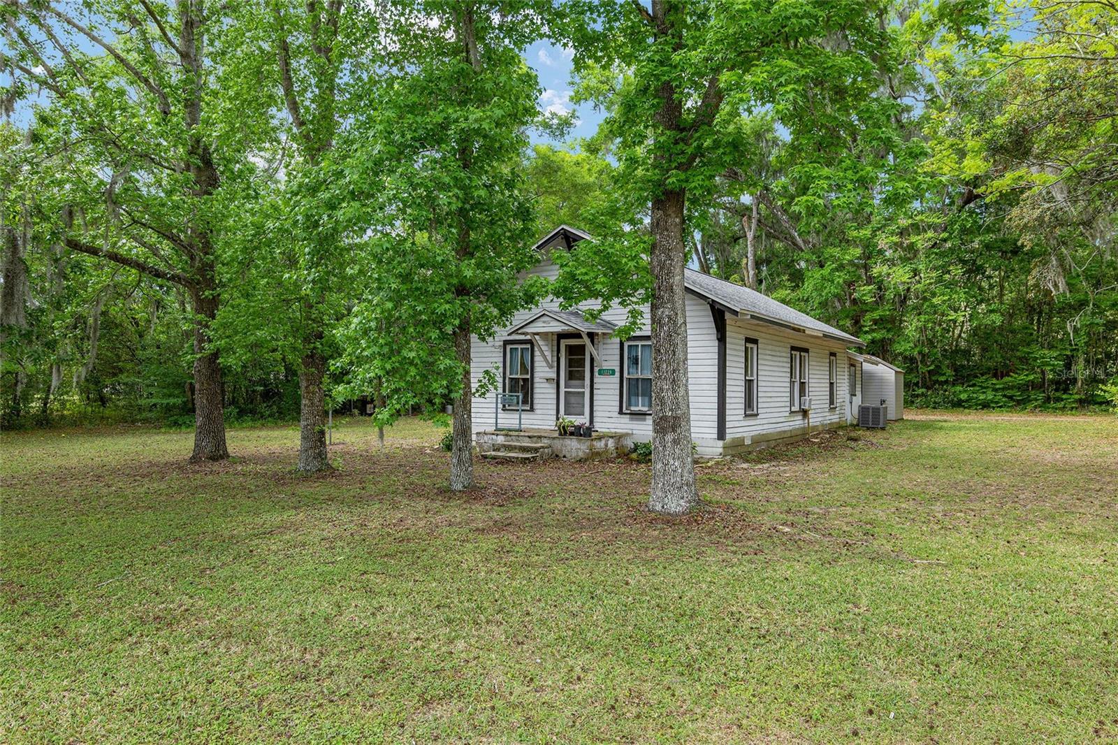 Single Family Home Bedrooms: 2 Bathrooms: 1 Living Space: 952 sq. ft. built in 1965 upgraded with the key essentials: This charming home boasts significant upgrades for peace of mind New roof installed in 2020, Updated A/C system 2020, Well Pump and Bladder replaced in 2023, Solar Panels installed 2020, Drain field recently upgraded in 2023. Enjoy the tranquility of 1.02 acres, perfect for gardening, outdoor activities, fire pit or possible home expansion. This home is conveniently located in the vibrant community of Belleview, Fl offering easy access to local amenities, parks and schools.