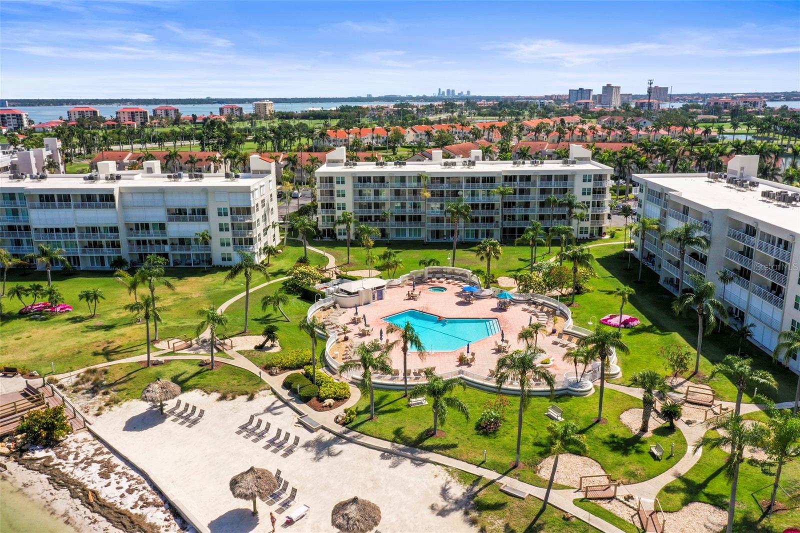 Amazing opportunity to own a top floor condo with breathtaking views and sunsets from your 25 ft. balcony. The condo is being sold furnished and turnkey making it the obvious choice for those seeking a move-in ready condo or for the investment-minded buyer. Bahia Vista II allows two-week rentals. There is plenty of space In a kitchen that overlooks the living/dining area featuring sliding glass doors that let in an abundance of natural light filling the condo with a warm and Inviting ambiance. The split floorplan offers privacy. The primary bedroom is a peaceful retreat with a walk-in closet, beautiful water views and direct access to the balcony. The spacious ensuite bath boasts double sinks and a garden tub for soaking after a fun-filled day at the beach. A comfortable second bedroom with an adjacent bath is perfect for hosting friends and family. Convenience continues with an in-unit laundry room and a shared storage closet by the elevator. The resort-style community offers assigned parking, ample guest parking, hot tub, heated pool, private beach with cabanas and fishing dock. The Isla del Sol community offers a range of recreational options, including a champion 18-hole golf course, a marina, clubhouse, fitness facilities, and tennis courts. Plus, you're just minutes away from the Gulf beaches, Ft. DeSoto, downtown St. Pete with its fine restaurants, museums, and shopping, as well as easy access to 1-275for quick trips to Tampa. For outdoor enthusiasts, the Pinellas Bike Trail runs right in front of the complex. Schedule a showing today to make this slice of paradise your very own.