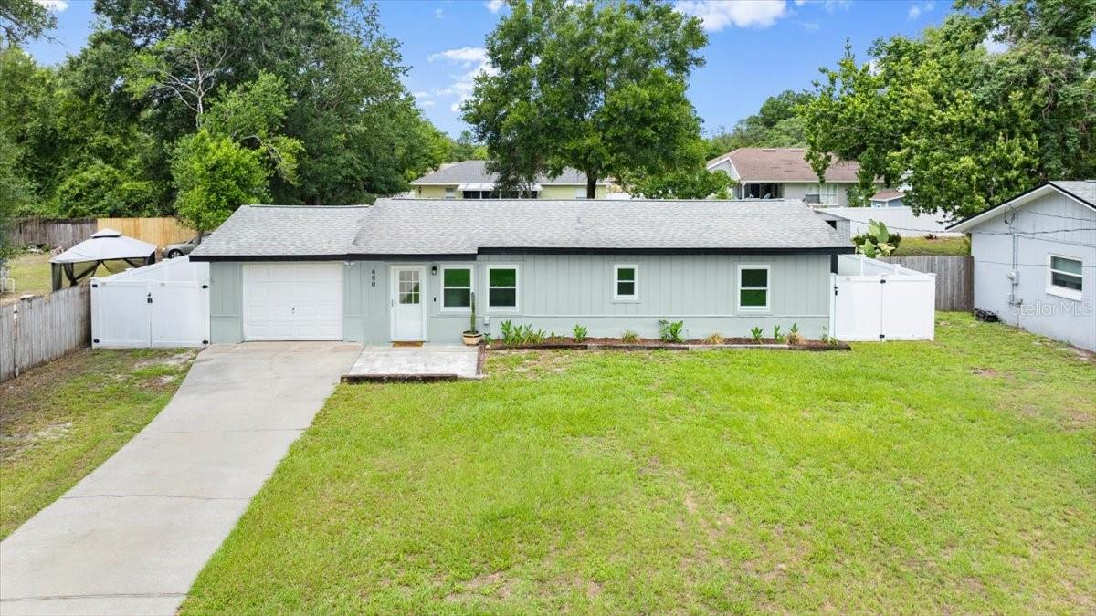 Charming and well-maintained home—perfect as a starter property or investment opportunity! Recent upgrades include a new roof (2017), A/C (2021), well (2018), and vinyl fencing (2019). The interior and exterior were freshly painted in 2025, and the kitchen and both bathrooms have been tastefully updated. Inside, the home features all tile flooring in most areas with waterproof laminate in the kitchen, bathrooms, and laundry room.
Enjoy added privacy on the fully fenced ¼-acre lot, complete with a dog run featuring artificial turf, a deck with water and electric, flower beds, a paver patio with fire pit, and a storage shed. The Florida room has been enclosed and equipped with an A/C unit creating bonus living space (not included in square footage). Additional highlights include new 3-panel windows throughout the home (garage excluded), updated exterior outlet boxes, and a drain field replacement with septic inspection completed in 2020.
Located on a paved road in a quiet area of Orange City, just 30 minutes to downtown Orlando and 10 minutes to downtown Sanford. No HOA!