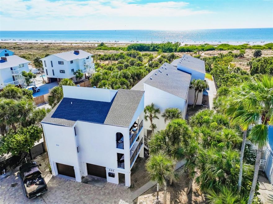 Experience refined Gulf-front living in this exquisitely renovated and fully furnished 3-bedroom, 2-bath coastal residence just steps from the powdery-quartz sand of world-renowned Siesta Key Beach. With deeded beach access and sweeping Gulf panoramas, this boutique retreat captures the essence of cosmopolitan island living.
Professionally managed with flexible weekly rentals and proven year-round income potential, this property offers both lifestyle and investment appeal. A short stroll leads to the vibrant dining, live music, and charming boutiques of Siesta Key Village, while a peaceful path through the coastal preserve brings you directly to the shoreline and its mesmerizing turquoise waters.
Located within an intimate five-residence enclave, the condominium has been thoughtfully renovated to reflect effortless coastal elegance. The open-concept interior showcases warm wood finishes, stainless steel appliances, and a beautifully designed kitchen that flows seamlessly into the living and dining spaces. Gulf views from the kitchen and a private balcony for sunset evenings elevate the experience even further.
Additional features include an enclosed one-car garage, an assigned open parking space, and access to a beautifully maintained community pool and outdoor entertainment area complete with grilling space, lawn games, and a convenient private storage unit.
Whether as a private seaside sanctuary, legacy family retreat, or high-performing investment, this exceptional property blends prestige, privacy, and prime location on coveted Siesta Key.  An extraordinary coastal jewel exclusively presented.