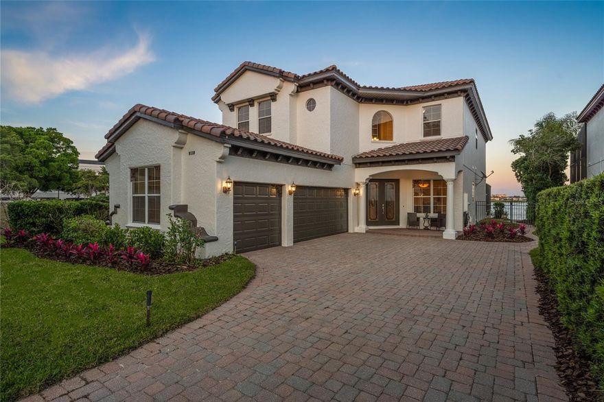 A rare opportunity to own a lake front home in the highly sought after 24-hour guard-gated community of Vizcaya, one of Dr. Phillips’ most coveted addresses. Perfectly positioned on an oversized corner lot, this exceptional Reiche-Silliman custom residence has a private dock on the pristine skiable waters of Little Sand Lake, a sparkling pool and spa, two expansive primary suites, and a three-car garage. Surrounded by mature landscaping and commanding panoramic lake views, the property delivers an exceptional blend of privacy, elegance, and waterfront living. Designed for both grand entertaining and everyday comfort, the interior welcomes you with a formal dining room and spacious living areas filled with natural light. The gourmet kitchen, complete with breakfast seating, opens effortlessly to the family room where a fireplace creates a warm focal point. Walls of sliding glass doors connect the living space to the screened lanai, inviting seamless indoor-outdoor living with serene water views as your backdrop. The first-floor primary suite serves as a luxurious private retreat, featuring his and hers walk-in closets, dual vanities, a walk-in shower, and an oversized jacuzzi tub. The main level also includes a laundry room and elegant powder bath. Upstairs, an oversized loft provides flexible living space, while the second primary suite with ensuite bath and dual closets offers ideal accommodations for guests or multigenerational living. Two additional bedrooms complete the upper level. This residence has been thoughtfully enhanced with a new tile roof (2024), first-floor HVAC system (2024), hot water heater (2022), exterior paint (2026), hardwood flooring (2020), pool pump motor (2022), and electric pool heater (2020). Ideally located just minutes from Orlando’s renowned Restaurant Row, upscale shopping, and world-class entertainment. This exceptional home is also a dream for golf enthusiasts due to its close proximity to the famed Bay Hill Club & Lodge and within a 30-minute drive of both Universal and Disney theme parks. Zoned for A-rated Bay Meadows Elementary, this is a truly special offering in one of Central Florida’s finest luxury communities.