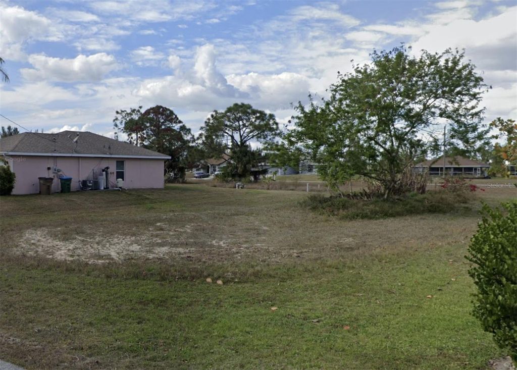 Photo of 2215 NE 34th Ln, Cape Coral, FL 33909 (MLS # O6342440)