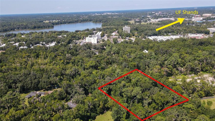BUILDER OPPORTUNITY NEAR UF, SHANDS, VET SCHOOL! RARE FIND! Discover the epitome of nature's embrace on this enchanting 2.13-acre wooded canvas, awaiting your architectural masterpiece. Nestled within the coveted SW Gainesville, this remarkable lot finds its place in the esteemed Kirkwood neighborhood, offering a unique blend of tranquility and urban proximity.

A haven of natural beauty, this parcel boasts a verdant landscape adorned with an array of mature trees, including majestic live oaks, hickory, sweet gum, and water oaks. Among the wonders of this property is a historically proven man-made Creek that gracefully winds through the land, enhancing the allure with its timeless charm. Along the entirety of the creek, a 75-foot setback preserves its pristine presence, ensuring a seamless coexistence of architecture and nature.

To further enhance the site's functionality and aesthetics, a strategic culvert installation was meticulously carried out by the City in October 2021. This thoughtful addition prevents rainwater runoff from inundating the swale, underscoring the commitment to preserving the natural integrity of the land.

Kirkwood unveils a harmonious lifestyle where modern convenience meets idyllic seclusion. Mere moments away, a world of shopping, delectable dining, leading hospitals, and the renowned University of Florida campus unfolds. Yet, within Kirkwood's boundaries, a serene ambiance envelops you, creating a picturesque retreat that stands in perfect harmony with the surroundings.

As you embark on the journey to craft your dream abode, envision a dwelling that encapsulates your aspirations while respecting the distinctive natural elements of this captivating property. With a canvas so richly adorned by nature, the possibilities are boundless, and the results promise to be truly extraordinary.

This 2.13-acre gem is more than just a parcel of land; it's an opportunity to create a sanctuary that embodies your vision, a masterpiece that marries architectural ingenuity with the timeless allure of nature. Embrace this rare chance to manifest your dreams in an unparalleled setting. Your future home, seamlessly woven into the fabric of Kirkwood's charm, awaits your imagination and inspiration.