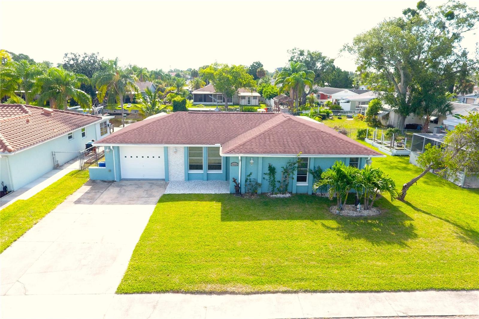 Waterfront Paradise-Fully Renovate & Move-In Ready. Welcome to your dream waterfront retreat!This beautiful updated home offers 2 spacious bed, 2 modern bath, plus a dedicated office space-perfect for working from home while enjoying serene water views. Step outside to your private dock (installed in 2022) with direct Gulf of Mexico access ideal for boating, kayaking, fishing or simple soaking in unforgettable sunsets. the back yard is a tropical oasis with coconut palm, pomegranate, lemon, and banana trees. The brand-new lanai ( updated in 2024) is perfectly designed, dividing the office from a dedicated entertainment room offering both productivity and relaxation spaces. the expansive deck, also built in 2024, is hot-tub ready for ultimate leisure. inside, you'll find brand-new stainless steel appliances, a 2025 A/C compressor, upgraded air ducts (2020), and a new garage door opener installed last month. A shed (2020) provides extra storage for all your outdoor gear. No HOA, NO CDD, just 45 minutes to Tampa International Airport. minutes from Downtown New Port Richey, restaurant, bars, shops, and parks. 20 minutes to weeki Wachee Springs State Park.