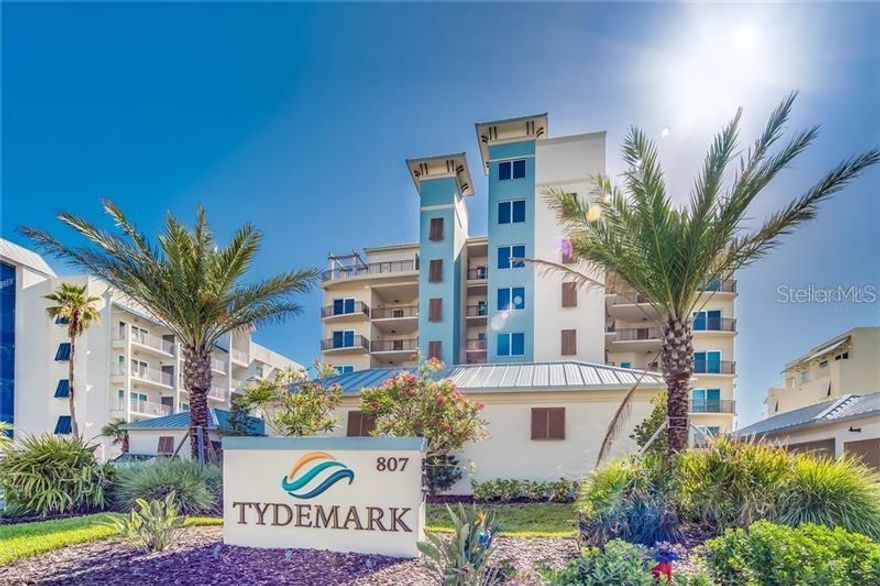 BREATHTAKING & UNBELIEVABLE view of morning sunrise from the ocean and sunset from the front balcony. Rare opportunity to own an Exquisite Luxury beachfront condo in Tydemark building in New Smyrna Beach. The unit can be purchased fully-furnished (turnkey) from linens to silverware and appliance for $1,250,000. This unit has NEVER been rented. This Luxury Boutique Ocean Front condominium fairly new construction, features 19 exclusive residences, two elevators, an Oceanside pool and oceanfront clubhouse with a fitness room. This spacious corner residence on the 4th floor offering 3 bedrooms 3 baths 10' ceiling heights, a wrap-around 337 SF balcony space looking over the Atlantic Ocean and a second balcony looking over the river and conservation area. The units has TWO deeded parking spaces one in the garage and the second under a covered structure out front along with a storage room. The ocean can be seen all around! Nothing but the highest quality finishes the space was decorated by a Winter Park designer. many upgrades and built-ins, quartz countertops, upgraded cabinetry in the kitchen and all 3 bathrooms. Kitchen includes an induction cooktop, spacious island, custom design light fixtures and custom powered blinds with remote control. Master ensuite features endless views of the beach with large oceanfront windows & sliding glass door to the oceanfront balcony, walk-in closet, luxurious tiled bath with double vanities. Enjoy oceanfront living all walking distance to Flagler Ave with all the shops and restaurants! This is the only condo available for sale in TydeMark one of the newest Oceanfront condominium buildings in New Smyrna Beach with the BEST LOCATION! ;Water: City