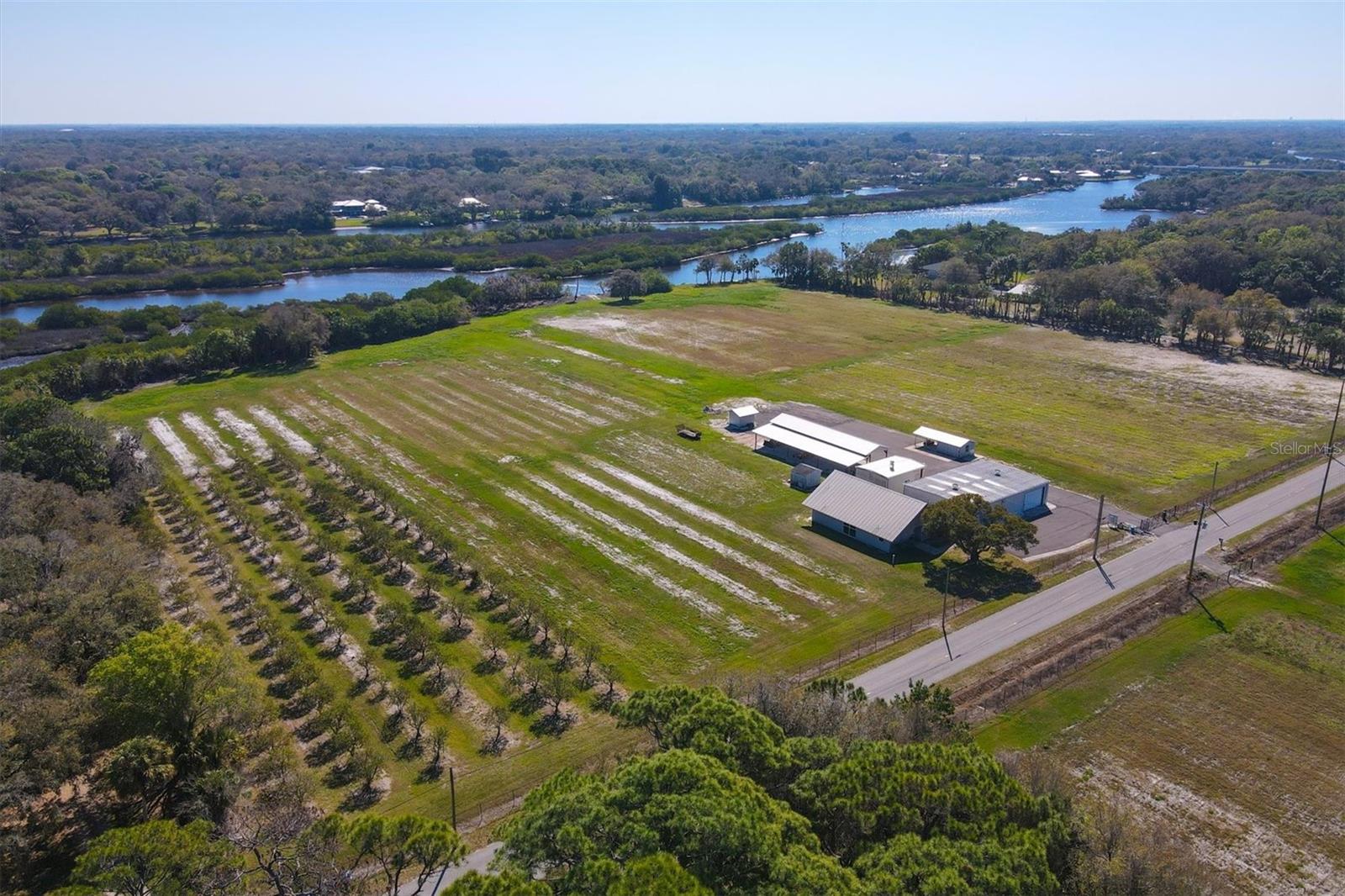 Impossible to find 15 +/- acres on the Braden River. So many possibilities... Horse Farm....Nursery.....Multiple large estate lots...Family Farm or compound. Property contains a house, 2 barns, a large pole barn and has a deep well for agricultural use. Ask Listing agent about the boat ramp on the property and the quotes for boat lift and docks. Call for a showing, this property is country, on the River and close to everything.