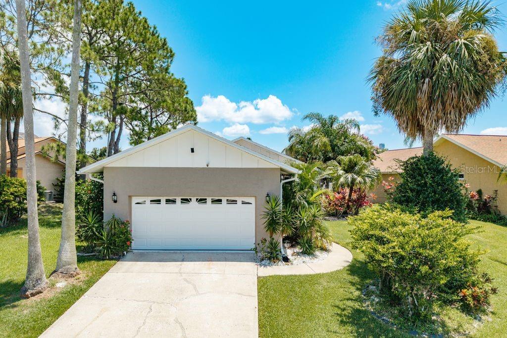 Waterfront Paradise with Pool in Gulf Harbors Sea Forest! This stunning 2-bedroom home with a den/office and 2 baths offers the ultimate Florida lifestyle – from boating and beach days to sunsets and dolphin sightings! Perfectly located in the desirable Gulf Harbors Sea Forest community, you’ll love being walking distance to downtown New Port Richey’s restaurants, shops, and parks, and just a 10-minute boat ride to the open Gulf with no bridges! Step inside to find Bruce® hardwood flooring throughout, paired with tile in key areas, and remote-control shades in the living room. The open, airy floor plan leads to a gorgeous outdoor oasis featuring a 2023 pebble tech resort-style pool with plenty of lounging space, an upper-level screened lanai with an outdoor kitchen complete with a gas BBQ, refrigerator, sink, grill, gas burner, and even a kegerator for effortless entertaining, a two-level deck with a 2021 new 10,000 lb. boat lift and dock – perfect for launching your Gulf adventures, and a tiki bar and lower-level workshop/storage area. 2023 new landscaping, roof, and 6-inch gutters. As a resident with a nominal annual fee, you can enjoy exclusive access to Gulf Harbors’ private white sandy beach, where sunsets are simply breathtaking. Whether you’re relaxing by the pool, hosting friends under the tiki bar, or watching dolphins swim by your dock, this home delivers the coastal dream lifestyle. Don’t wait – this one won’t last!