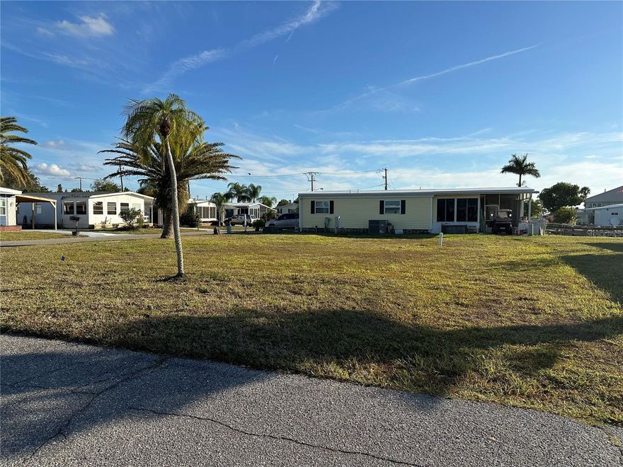 Build your Florida dream home on this vacant corner lot located in the desirable 55+ community of Harbor Cove in North Port. This spacious corner parcel offers added privacy and flexibility for home placement, making it an excellent opportunity for a custom-built manufactured home. Harbor Cove is a friendly, well-maintained community known for its relaxed coastal lifestyle and convenient location. Residents enjoy easy access to shopping, dining, medical facilities, and the Gulf beaches, along with community amenities and an active social atmosphere. Whether you’re planning a seasonal getaway or a full-time residence, this lot provides a great foundation to create your ideal Florida retreat.