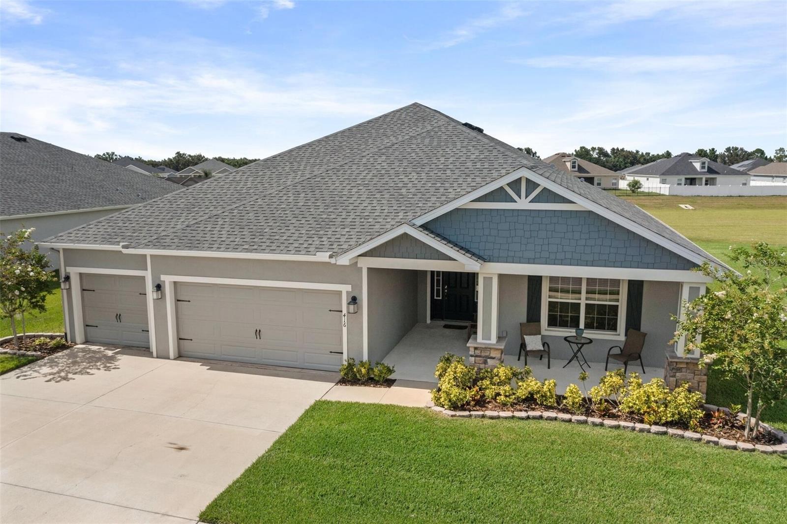 This is it! The best property at the highly desirable gated community of Juliana Village is now available. Located on a quiet, low-traffic street, this 5-bedroom, gorgeous, high-ceiling home on an unusual oversized full 1/4 acre lot makes living easy with everything on one floor. The huge kitchen with the largest island you’ve ever seen and granite countertops, faces a big open concept family room. Tons of soft-close cabinets and drawers plus a convenient kitchen desk and massive walk-in pantry. Enjoy your meals either sitting at the 7-place island, or the kitchen table OR the formal dining room (yes, it has all three areas!). Look out the back windows to a pond or beautiful green natural area. The Highland Homes “Wynter” plan is one of the largest in the community with upgraded flooring, countertops, tile, carpet, HVAC, Wi-fi enabled, internet -weather advised multi zone in ground sprinkler system, laundry room clothes-folding countertop and full upgraded cabinetry with soft-close gliders and closers, 3 car garage (with pull down stairs to the attic storage), huge master bedroom closet, gutters, French drains, and ceiling fans in every room. Kitchen refrigerator, range, microwave included. Everything is done for you. Taexx built-in pest control system. It’s completely move-in ready and beautifully cared for. Low taxes, no CDD, and reasonable HOA fees make it one of the easiest and affordable places to live. Brand new Publix and restaurants just a mile away, and only 2 miles from I4 for easy commuting. Everything has been done for you so you can sit on your very own front porch or in the back screened-in lanai. Transferable structural home warranty. Search your search engine for "416 Riders Loop for sale video." Easy and ready to go.