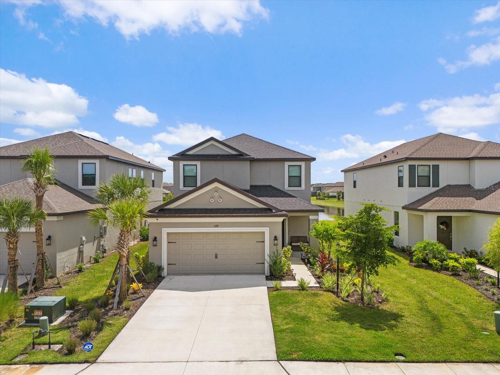 Welcome to this brand-new Taylor Morrison home, perfectly situated just 30 minutes from world-class beaches and 20 minutes from vibrant downtown Sarasota. Offering the ideal balance of luxury and convenience, this property is designed for modern living at its finest. The main level features a dedicated office, perfect for remote work or study, along with a bright open-concept living area that seamlessly connects to a gourmet kitchen. The first-floor primary suite is truly impressive with tray ceilings, a generous layout, and a relaxing retreat-like feel. Upstairs, you’ll find three additional bedrooms, a massive bonus media room for entertaining or movie nights, and a versatile loft space—an ideal spot for kids to learn, play, or unwind. As part of this community, you’ll enjoy access to resort-style amenities including a sparkling pool, basketball court, playground, and even a hiking hill. Whether you’re looking to relax or stay active, there’s something here for everyone. This stunning home is available now and is being offered unfurnished. A 6-month lease is available at $5,000 per month. Don’t miss the chance to experience luxury living near Sarasota—schedule your private showing today! Available immediately.