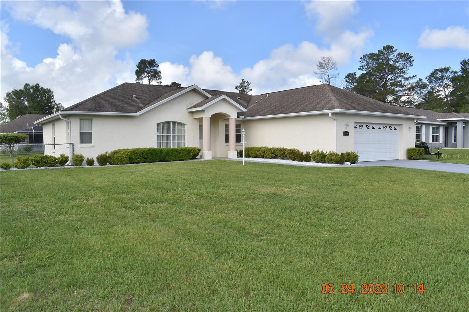 CHECK OUT THIS BEAUTIFUL 3/2 HOME IN MARION OAKS, WELL MAINTAINED WITH MANY UPGRADES, IT HAS A SCREENED IN FLORIDA ROOM IN THE BACK OF THE HOME WITH A TILE FLOOR AND A SIDE CARPORT FOR YOUR DRIVE ON MOWER AND YARD TOOLS. A NICE LITTLE EXTRA. HOME COMES WITH AN ALARM SYSTEM, SMOKE DETECTOR & UNDERGROUND YARD SPRINKLER SYSTEM - TO KEEP YOUR LAWN NICE AND GREEEN. A LARGE 2 CAR GARAGE WITH AN ELECTRONIC GARAGE DOOR OPENER. ANOTHER NICE UPGRADE IS THE WATER FILTRATION SYSTEM IN THE HOUSE. AN EAT AT COUNTER IN THE KITCHEN WORKS WELL - THE HAS THE USUAL APPLIANCES PLUS A GARBAGE DISPOSAL. SHOPPING, RESTAURANTS AND DOCTORS ARE NOT FAR AWAY. COME SEE THIS LARGER 3-2 BLOCK HOME, YOU'LL WANT TO MAKE IT YOURS......