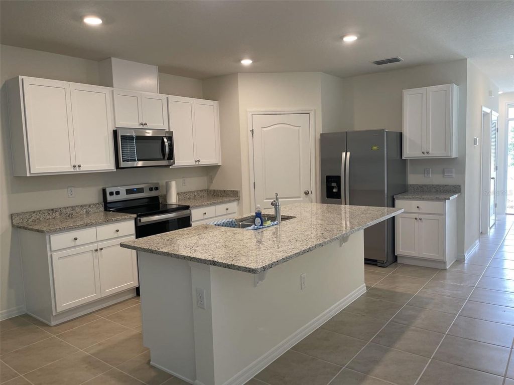 Photo of 927 Waterfall Boulevard, Davenport, FL 33837 (MLS # O6408015)