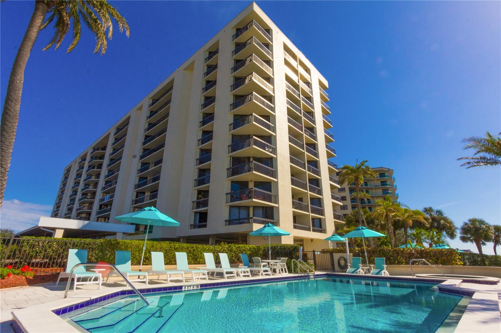 Live at the Clearwater Beach community of beautiful Island Estates. This condo is the ultimate in a coastal lifestyle! The stunning and rare floor plan includes 2 bedrooms PLUS a home office or bonus room and 2 baths laid out in a split floor plan. This open and updated condo has been meticulously cared for. The A/C was installed 2022. The water heater was new Jan 2020. Gorgeous bamboo flooring throughout the living and bedrooms. This summer the condo was freshly painted, and new pocket doors installed on the office / bonus room for privacy when working from home. The kitchen features gorgeous solid wood cabinets with a lot of storage, wine refrigerator & beautiful granite counter tops. The 25' balcony that is accessible from both bedrooms as well as the living room will quickly become your favorite room. Sunrises and sunsets are phenomenal from this balcony. Added features of this condo is the washer and dryer in the unit, hurricane shutters, covered reserved parking, and storage closet outside your front door (4A). Yes, this building is pet friendly too! Either 2 pets - 25 lbs. or one 50 lbs. Enjoy Island Walk's resort-like amenities: waterfront heated pool, hot tub, tennis courts/pickleball, shuffleboard, BBQ grills, picnic area, bicycle storage, car wash, and boardwalk for sunset strolls. Owners can purchase or lease boat slips from individual owners. Island Walk is a well-maintained building for buyers' peace of mind. Solid concrete building with a generator and hurricane shutters to ease your storm anxieties. The building was recently painted. Spring 2021 new roof and common area A/C units updated. 2018 Balcony / railing / patio gemstone coating. Island Walk is a true waterfront oasis - an excellent choice for a vacation home, year-round luxury living or buy for an investment and rent. .