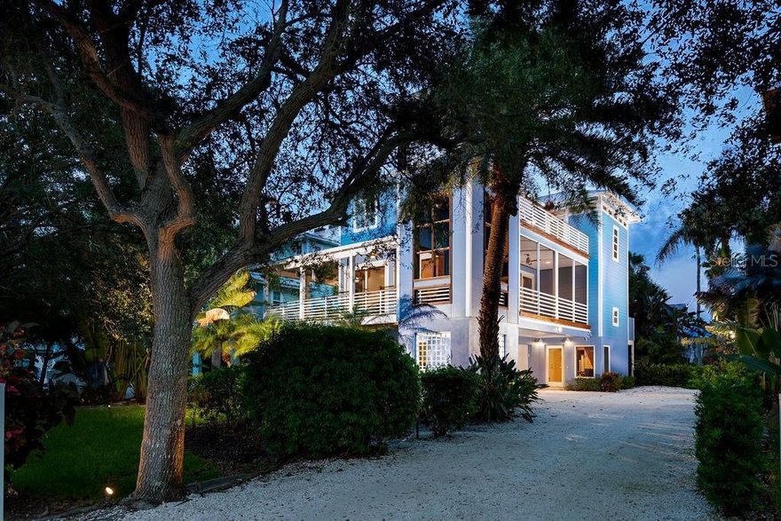 This stunning, island residence is located adjacent to the magnificent white-sand beach of the Gulf of Mexico.  Perfect as a primary or second home,  this Conrad Beach gem sits on a maintenance free home site at the north end of  world famous Longboat Key.  Offering three levels of luxury living with stylishly updated finishes and classic beach furnishings, this home will provide all that you and your guests need to enjoy paradise.  This well-designed custom home features a bright and spacious great room with wrap-around sliding-glass doors that seamlessly offer easy entertaining access to the wrap-around ipe decked porches.   The lovely beach-inspired finishes include walls clad with shiplap planking, wood floors, new designer lighting/ ceiling fans and Hunter Douglas woven window treatments.  The chef’s kitchen gleams with new quartz countertops, new sinks and faucets, new marble backsplash with beautiful glass inserts, beautiful white soft-close cabinets, and new appliances including a dual-fuel Viking gas range, a Bosch dishwasher and refrigerator, Viking microwave, wine/beverage cooler and Electrolux washer & dryer. The spacious primary bedroom is complete with a luxury bath, large walk-in closet and a private balcony overlooking the scenic tropical landscape. The top floor provides your guests with two large bedrooms, a spacious loft for private lounging and additional sleeping space, new carpet, new lighting and two beautifully updated bathrooms.  One bedroom accesses the upper balcony where sunset views can be enjoyed.  The ground level contains a 437 sq ft screened lanai that is perfect for additional entertaining space or a game room.   The spacious 2 car garage offers a separate work or storage area for beach toys. The neighborhood is well manicured and the low HOA fees include a wonderful community pool, your lawn/landscape maintenance, irrigation system, and basic cable. This historic area exudes the lifestyle that attracted the first residents to Longboat Key and Longbeach Village. The Village and its exceptional restaurants are with walking distance and access to world famous St. Armands Circle. This is a very special home comes completely furnished, including TVs and audio electronics and is ready for you!