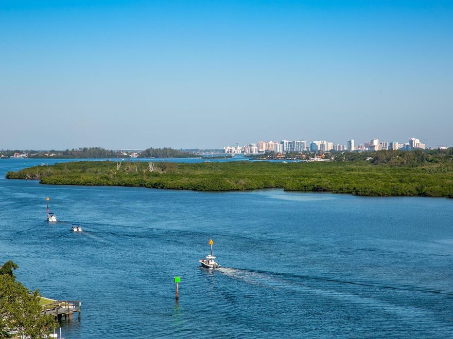 Coastal Luxury on Siesta Key. This three-bedroom, three-and-a-half bath condominium is located in the renowned and distinguished gated community of Summer Cove. This spacious residence lives like a single-family home and includes private beach access across the street to the world-famous white quartz sugar sands of Siesta Key Beach on the beautiful azure waters of the Gulf of Mexico. The nearly 2,500 sq. ft. Arcadia model features an open concept floor plan designed for entertaining, the large living and dining areas flow seamlessly to the updated gourmet Island kitchen which features a pantry, wood cabinetry with custom pull-outs, quartz countertops, built-in Wolf oven, Bosh induction cooktop, hood and dishwasher, stainless steel appliances, LED pendant lighting and a separate service bar. Enjoy stunning panoramic views of the Intracoastal waterway to Downtown Sarasota and the mainland from this 7th floor end unit with expansive terraces and open living areas through sliding impact glass doors and windows on every exterior wall. Watch the Sunrise in the East and the Sunset in the West as there are 180 degree views. The primary bedroom opens to a private terrace with a wall of sliding glass doors, two large walk-in closets with custom built-in’s and a spacious en-suite bath with granite counter top, dual sinks, soaking tub w/jets, a separate shower and LED lights. Two additional guest suites with private baths and walk-in closets are thoughtfully located at the opposite end of the residence for complete privacy with access to a terrace with partial gulf views and sunsets. One of the bedrooms is currently used as a home office. The large laundry room features a LG washer and dryer, large sink with cabinets, additional wall storage cabinets and an iron-away, a door to the private service elevator is located in the laundry room. Additional features include a half bath, 3 private terraces, Hunter Douglas custom window treatments, California closets, tray ceilings, crown molding, fans and water softeners in the building. From the secure lobby entrance, the elevator delivers you to your private foyer entrance. There is also a service elevator to the unit from the lobby. Two assigned premium parking spaces in the secure garage are included, private storage cage and additional storage for bicycles, kayaks available in the garage. Summer Cove is a private gated amenity filled community for an active lifestyle on 3.5 lush acres nestled in a canopy of majestic oaks, mature landscaping and lawn on the Intra-Coastal Waterway. The clubhouse was designed by world-renowned architect Carl Abbott in the Sarasota School of Architect style and was (the original home to the Summerhouse Restaurant). It is listed in the historic registry of Sarasota. Amenities include a fully equipped fitness center, large gathering room, media room, card room, billiard room and kitchen. There is easy access to the bay front resort-style pool and spa with a grilling area and ice machine. On the bay front-ICW there is a pier with hydraulic lift for Kayak, Paddleboard and Canoe launching. A Pet-friendly community, two pets are permitted with no weight limit. Minutes to Siesta Village, a short drive to downtown Sarasota’s cultural and urban amenities, which include world-class museums, opera, ballet, symphony, theatre, shopping and dining. Enjoy the wonderful Siesta Key Lifestyle! Rarely available and first time on the market for this unit.