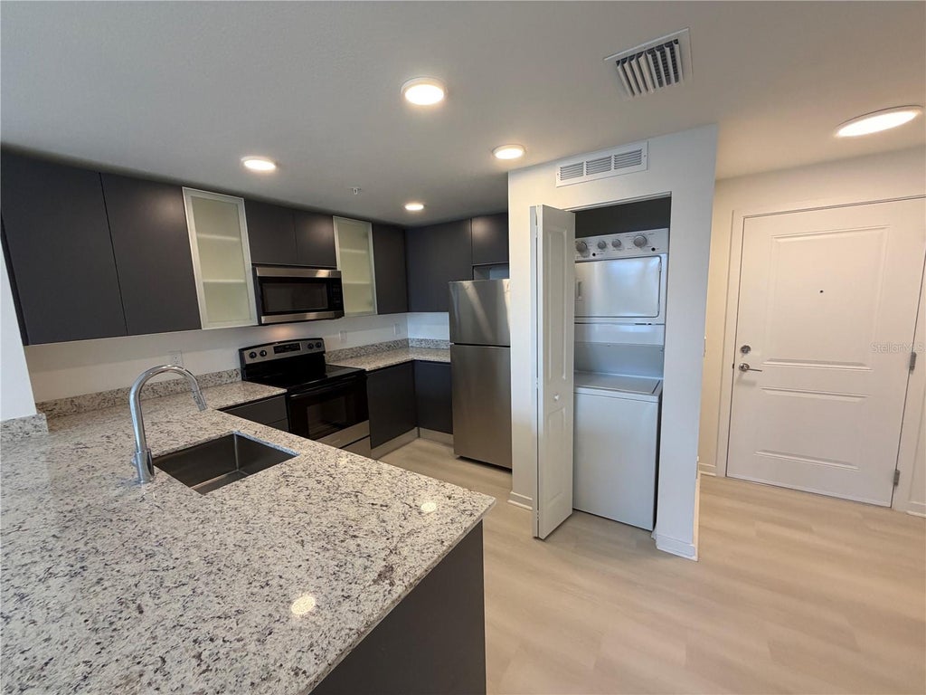 Photo of 5587 Millenia Park Blvd #403, Orlando, FL 32839 (MLS # O6413212)