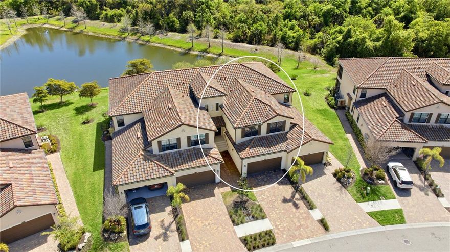 This stunning Brandywine Coach Home in the desirable Gran Paradiso neighborhood of Wellen Park, offers penthouse-style living on the second floor. Featuring a tandem 3-car garage, split stairwell entry, and oversized rooms throughout, this home delivers both space and style.
At approximately 2,100 square feet, an open-concept great room design creates a bright, modern, and inviting living space. Boasting an extraordinarily large primary bedroom along with very generously-sized secondary bedrooms. The master suite is particularly impressive, with two walk-in closets, a spacious en-suite bath featuring a large shower, dual vanities, and sliding doors that open directly to the lanai.
Filled with natural light, thanks to abundant windows and glass, the home offers breathtaking private views. What makes this coach home truly unique is its rare combination of both water and preserve tree views — a rare nature perspective!
Perfect for both seasonal and full-time residents, this maintenance-free coach home provides effortless living with full impact windows and sliders for added peace of mind and hurricane protection. The meticulous owners, ones who appreciate high quality, spared no expense, equipping the home with state-of-the-art LG appliances, brand-new carpet on the stairs and in the bedrooms, fresh high-quality washable paint throughout the interior, a Kinetico water softener and reverse osmosis system, and whole-house surge protection, plus the 3 bay garage had professional custom premium epoxy floors installed among other things. 
Additional interior upgrades include elegant quartz countertops, a stylish kitchen tile backsplash, and beautiful crown molding throughout.
This Oleander Coach Home represents the pinnacle of comfortable, low-maintenance luxury living in Gran Paradiso. 
THE NEIGHBORHOOD, Gran Paradiso, is a premier gated community nestled within the vibrant master-planned enclave of Wellen Park in Venice, Florida. This Tuscan-inspired haven spans over 1,000 acres. Over 60% of the neighborhood is wooded preserve or pond. The grand clubhouse serves as the heart of the community, featuring a state-of-the-art fitness center, aerobics and yoga studio, sauna and steam rooms, a library, card room, and billiards. Dive into relaxation at the heated resort-style pool with zero-entry access, and a separate spa; or stay active on lighted tennis courts, lighted pickleball courts, and miles of sidewalks throughout the neighborhood. A full-time activities director ensures a calendar brimming with social events, classes, and gatherings. Gran Paradiso's prime location puts the best of Southwest Florida at your doorstep. Just 1 mile from the lively Downtown Wellen Park with its shops, dining, and entertainment, 9 miles to charming downtown Venice, 7 miles to pristine Gulf Coast beaches for sun-soaked days, and a mere 1.2 miles to the brand-new Costco for everyday conveniences. Proximity to US-41 and I-75 offers easy access to the Atlanta Braves' CoolToday Park spring training facility, championship golf courses, boating opportunities, cultural events, and more. Gran Paradiso delivers timeless architecture, maintenance-free living, and a secure, gated environment.