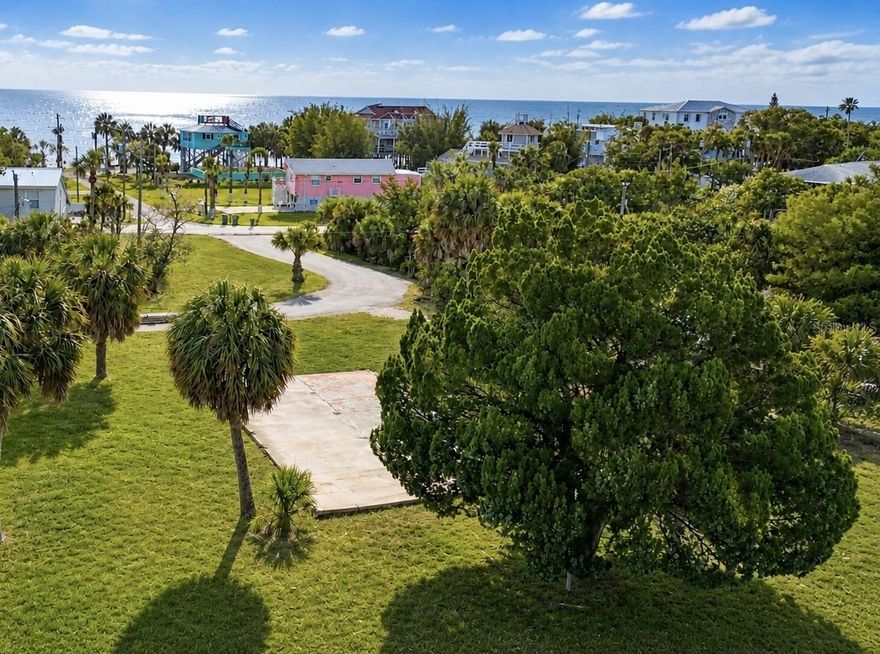 Rare opportunity to own a waterfront building lot on beautiful Pine Island, one of Hernando County’s most unique coastal settings. This cleared and buildable homesite offers the hard-to-find combination of water frontage, Gulf access, and true coastal lifestyle appeal. Positioned along a saltwater canal with Gulf access and water views, the lot features approximately 75 feet of waterfront, a concrete seawall, and a floating dock. Public water and private septic are in place, and impact fees have been paid, creating a net savings to the future owner. Enjoy the quiet, old-Florida character of Pine Island with the convenience of beach access just steps away on Harbor Drive, which lines up with the lot. The property is also just a short distance from Alfred McKethan / Pine Island Park, which can be accessed by road or by boat from the property. Residents and visitors enjoy the beach, swimming area, picnic shelters, observation point, playground, concessions, unforgettable Gulf sunsets, and magnificent sunrises across the marsh. Whether the vision is a full-time waterfront residence, seasonal escape, or custom coastal home, this property offers the lifestyle buyers are looking for: boating, fishing, kayaking, sunset views, nearby beach access, and easy access to the Gulf, all from one of Weeki Wachee’s most desirable waterfront communities. Buyer to verify all building requirements, utilities, impact fees, flood zone requirements, water depth, dock/seawall condition, HOA/boat ramp access, beach access, and permitted uses with the appropriate authorities.