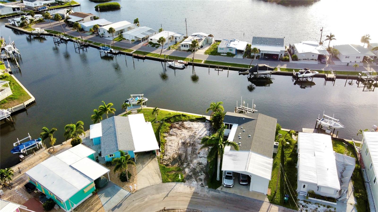 Your WATERFRONT DREAM Starts Here. Wake up to SHIMMERING WATER VIEWS and wind down with GOLDEN SUNSETS—right from your back porch. This CLEARED WATERFRONT LOT in TROPIC ISLES, a 55+, RESIDENT-OWNED Community is waiting for your perfect manufactured home. Tropic Isles offers marina access to Terra Ceia Bay, plus upgraded amenities like a heated pool, clubhouse, fitness room, shuffleboard courts and more. Bring your vision and start living the Florida waterfront lifestyle you’ve always wanted. Lots like this don’t come often—Claim your space now before it’s gone!