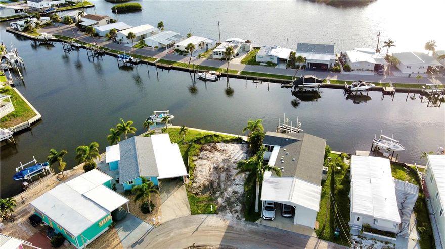Your WATERFRONT DREAM Starts Here.  Wake up to SHIMMERING WATER VIEWS and wind down with GOLDEN SUNSETS—right from your back porch.  This CLEARED WATERFRONT LOT in TROPIC ISLES, a 55+, RESIDENT-OWNED Community is waiting for your perfect manufactured home. Tropic Isles offers marina access to Terra Ceia Bay, plus upgraded amenities like a heated pool, clubhouse, fitness room, shuffleboard courts and more. Bring your vision and start living the Florida waterfront lifestyle you’ve always wanted.  Lots like this don’t come often—Claim your space now before it’s gone!