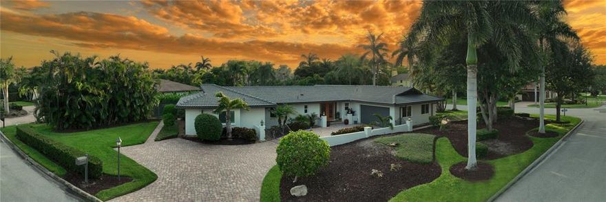 Bird Key, which has been considered the Jewel of Sarasota, is ideally located on a barrier island situated between downtown Sarasota and St. Armands to the beautiful beaches of Lido. This beautiful garden home, located on a large corner lot in Bird Key, has been remodeled and updated with a warm modern design offering a spacious open floor plan with three bedrooms and three baths. Multiple glass doors open the back of the home to the tropical lanai area with a sparkling pool, spa and an outdoor kitchen for entertaining your guests. Complete with a screened sitting area, a large covered patio and a private sitting area off the master bedroom to relax after a day at the beach. The privacy of your luscious backyard will also delight. The updated kitchen has an elegance and modern feel you will love. The large master suite and bath are a modern design to enjoy including separate dual walk-in closets. Inside the home there is wood flooring, tile in the baths, impact windows, Hunter Douglas door treatments and plantation shutters. The garage has been finished with a floor coating and plenty of cabinetry. Bird Key is 250 acres of lush, mature landscaping with around 511 homes. It is rich with history and one of Sarasota's most sought-after luxury communities. Directly across from its entry is Bird Key Park that offers opportunities to windsurf, paddleboard, kayak, diving and just getting a little sun. Inside Bird Key, you will find the Bird Key Yacht Club and marina. It offers memberships and slip rentals along with casual and fine dining, fitness center, tennis courts, pool and kayaking launch. The Sarasota Yacht Club, also close by, is another opportunity to enjoy the boating lifestyle that Sarasota offers. Are you ready to start enjoying the lifestyle you were meant to?