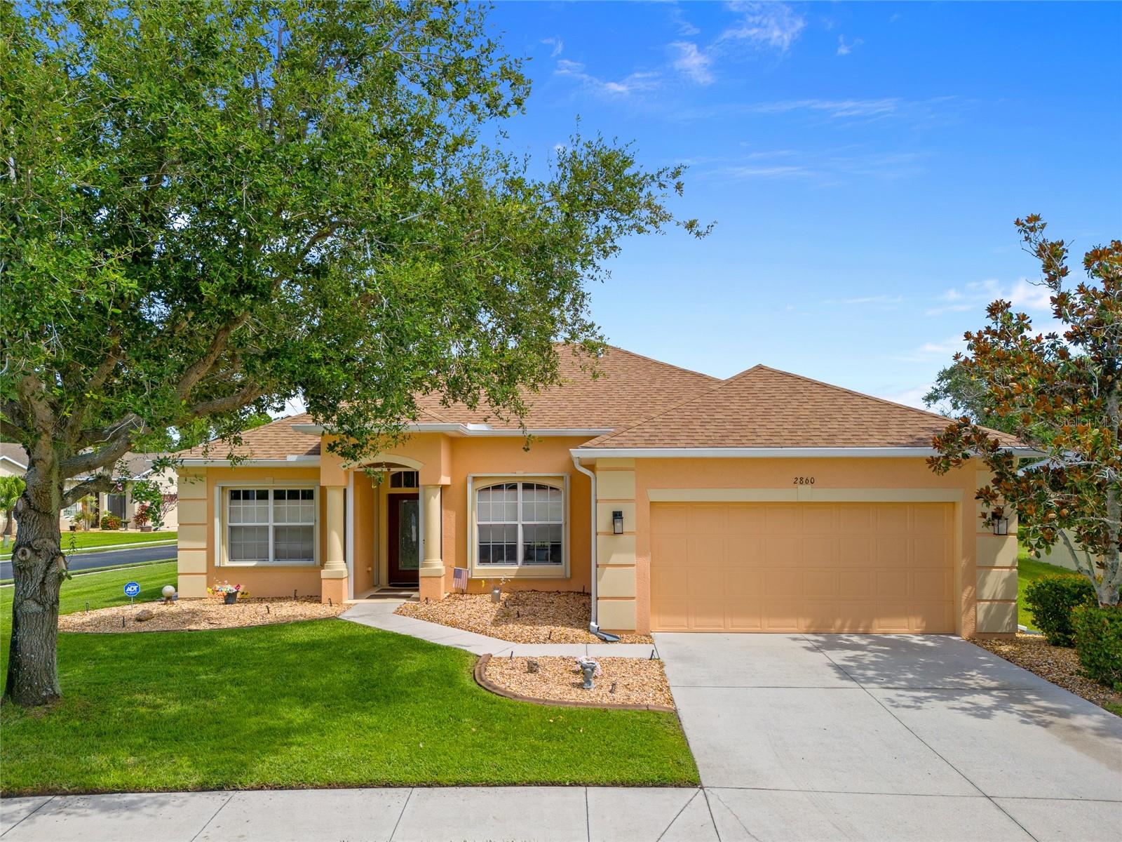 CORNER LOT! SPACIOUS 3 BEDROOM PLUS DEN, 2 BATH, 2-CAR GARAGE HOME LOCATED IN THE GATED COMMUNITY OF SUNCOAST LAKES. Open floorplan with 2,025 square feet of living area, high ceilings and ample space for family living or hosting guests, and ADA accessible throughout. Step inside to a living and dining room with windows and slider overlooking greenery yard views. The kitchen offers wood cabinetry, stainless-steel appliances and breakfast bar creating a perfect space for entertaining. Generous primary bedroom has high ceilings, large walk-in closet, and slider to lanai. Private en-suite bath features dual sinks and walk-in shower. Two guest bedrooms are nicely sized and share full guest bath. Step out back to screened lanai for shaded relaxation. Plenty of room to add a pool in the future. Additional features include newer luxury vinyl flooring, hurricane shutters, 2-year-old roof, 2-year old AC, 2019 7.82kw solar system owned and paid off, heat detector in garage connected with the alarm system, and Kohler 20k whole house automatic standby generator with owned 250 gallon tank barrel. Very well maintained, clean and quiet pet-friendly neighborhood perfect for walking and running. Suncoast Lakes amenities include gated access, community pool, park/playground, irrigation-water, cable tv and trash. Central location nearby golf, shopping, schools and about 5 miles from downtown historic Punta Gorda with community events, entertainment, fishing and boating. Don't miss this opportunity! Schedule your private showing today!