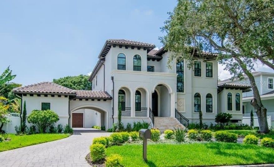A beautiful custom Taralon home located in the heart of Sunset park. This 2015 upscale build was designed to be an open floor plan with spacious living areas and the perfect environment for large scale entertaining. This homes exterior features include a unique porte-cache with oversized 3 car garage, massive rear lanai with fireplace, custom wrought iron doors, and salt water pool and spa. The first floor includes a formal dining room, game room, office nook, spacious owners retreat, laundry room, mudroom, gourmet kitchen and large family room. Some custom features of the primary level include a 2 story foyer, oversized his and her closets, Restoration Hardware light fixtures, custom marble fireplace and butlers pantry with wine fridge and built in nugget ice maker. The second floor includes 3 large en-suite bedrooms and a beautiful oversized laundry room. This is a stunning home and a great opportunity to live in the most desireable neighborhood without the wait of new construction.