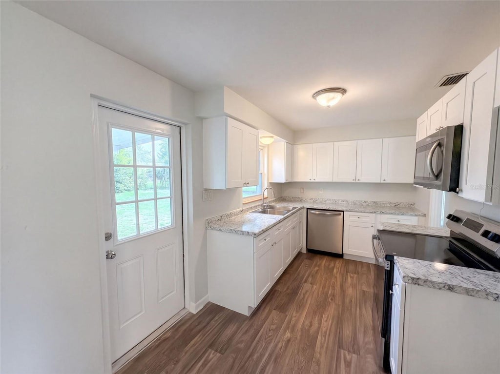 Photo of 411 W Seminole Avenue, Eustis, FL 32726 (MLS # O6446227)