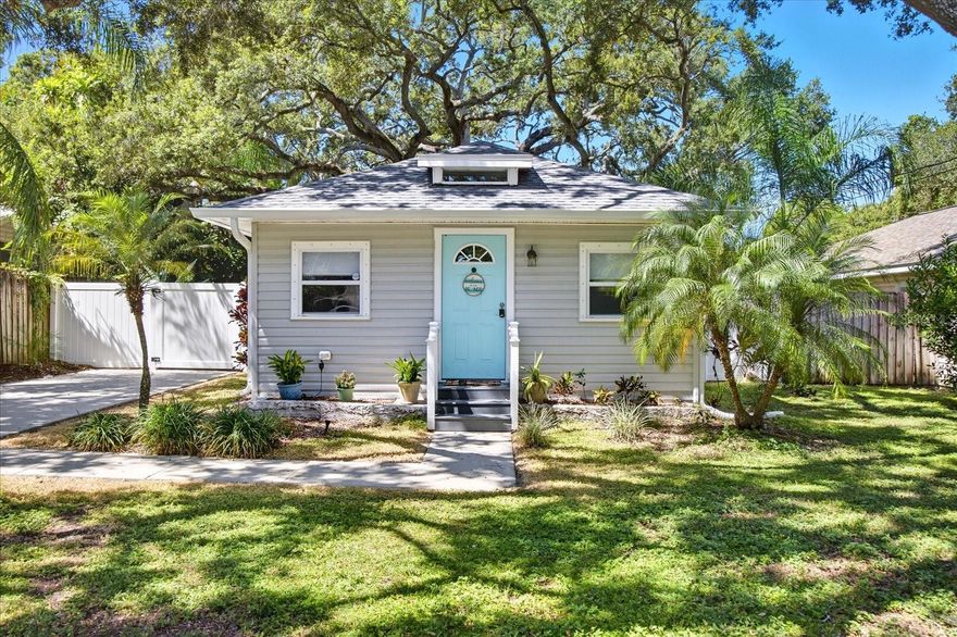 Coastal Cottage Vibes in the heart of Dunedin! This charming bungalow brings the best of Florida living with a laid back, stylish twist.  Step inside and you'll love the cool, coastal-inspired colors, the abundance of natural light through newer double pane windows equipped with hurricane shutters.  Light LVP flooring flows throughout the home. The updated kitchen features white cabinetry, granite counters and is designed with the chefs in mind - yes, there is a gas stove!  Outside you will find a fully fenced yard for your four-legged family members who are excited to move to "Dogedin".  The focal point of the backyard is the magnificent historic Grand oak tree that is professionally cared for. In addition, there is a spacious patio perfect for entertaining friends or just enjoying quiet evenings under the branches and a shed for additional storage.  The roof was replaced in 2020 giving peace of mind.  This location doesn't get any better!  Hop on your golf cart or take a quick stroll down the street to Downtown Dunedin where you will find restaurants, breweries, cafes, concerts, baseball, markets and more.  This home is not in a flood zone and did not sustain any storm damage from recent hurricanes. If you are looking for charm, character, and a lifestyle that's all about sunshine and a vibrant downtown community, this is the one!