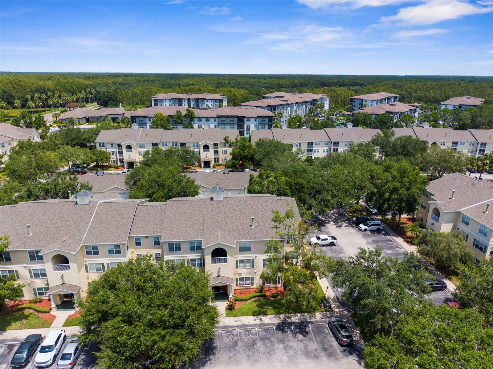 Welcome to your ideal New Tampa home—this move-in ready 1-bedroom 2nd floor condo (with a RARE detached one car garage) is tucked inside a quiet, gated community with a low HOA of just $262/month and offers a thoughtful layout filled with upgrades. Freshly painted in 2025 with brand new carpet and a brand new HVAC system, the unit opens to a spacious living room with elegant crown molding and plenty of natural light. The kitchen features beautiful granite countertops and connects seamlessly to a dedicated dining area, perfect for everyday meals or casual entertaining. Just off the main living space, a versatile flex room makes for an ideal home office or reading nook. The oversized bedroom includes a walk-in closet and direct access to a large bathroom with a garden tub and separate walk-in shower. An in-unit laundry room with washer and dryer adds everyday convenience. Residents of Equestrian Parc enjoy a full suite of amenities—pool, gym, tennis and volleyball courts, playground, car wash station, clubhouse, and more—all just minutes from I-75, USF, AdventHealth, AMC Theatres, Home Depot, Walmart, and the shops and restaurants of Wiregrass Mall and Tampa Premium Outlets. A rare opportunity to own in a prime location with long-term value and lifestyle built in.